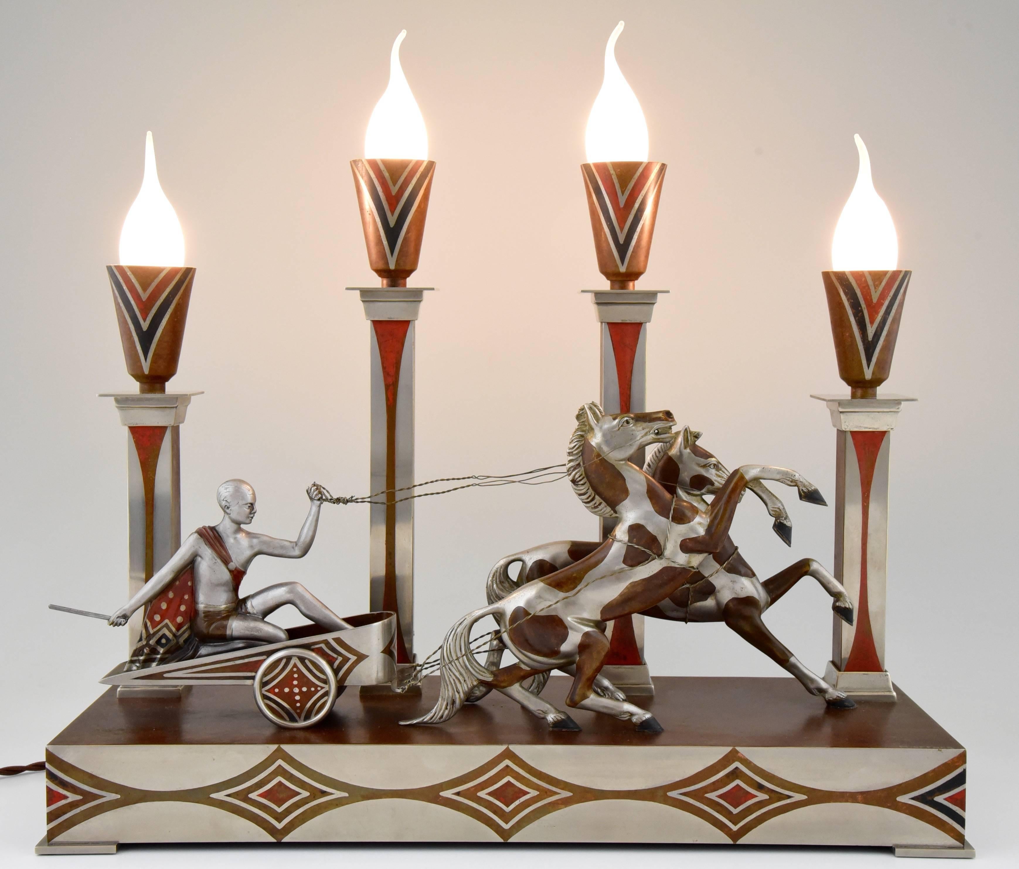 Rare French Art Deco four-light table lamp with charioteer and two horses signed by M. Offner with multicolor patina.

Artist or maker:
M. Offner.
Signature or marks:
M. Offner.
Style:
Art Deco.
Date:
1930.
Material:
Bronze and metal with