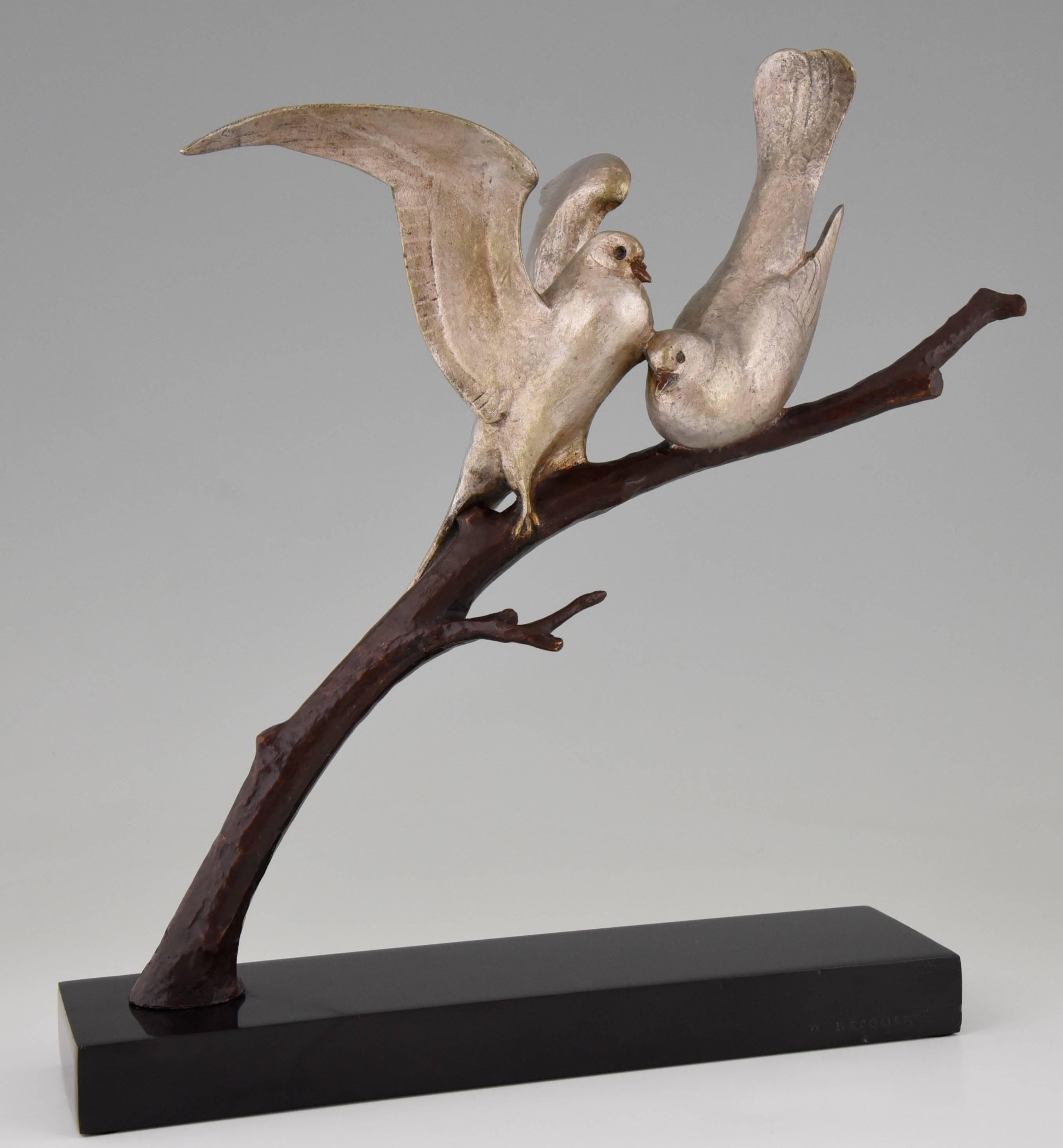 Very nice Art Deco sculpture of two love doves on a branch by the French artist Andre Vincent Becquerel. On a Belgian black marble base. 

Artist / Maker:
Andre Vincent Becquerel
Signature / Marks:
A.V. Becquerel, foundry mark, numbered,