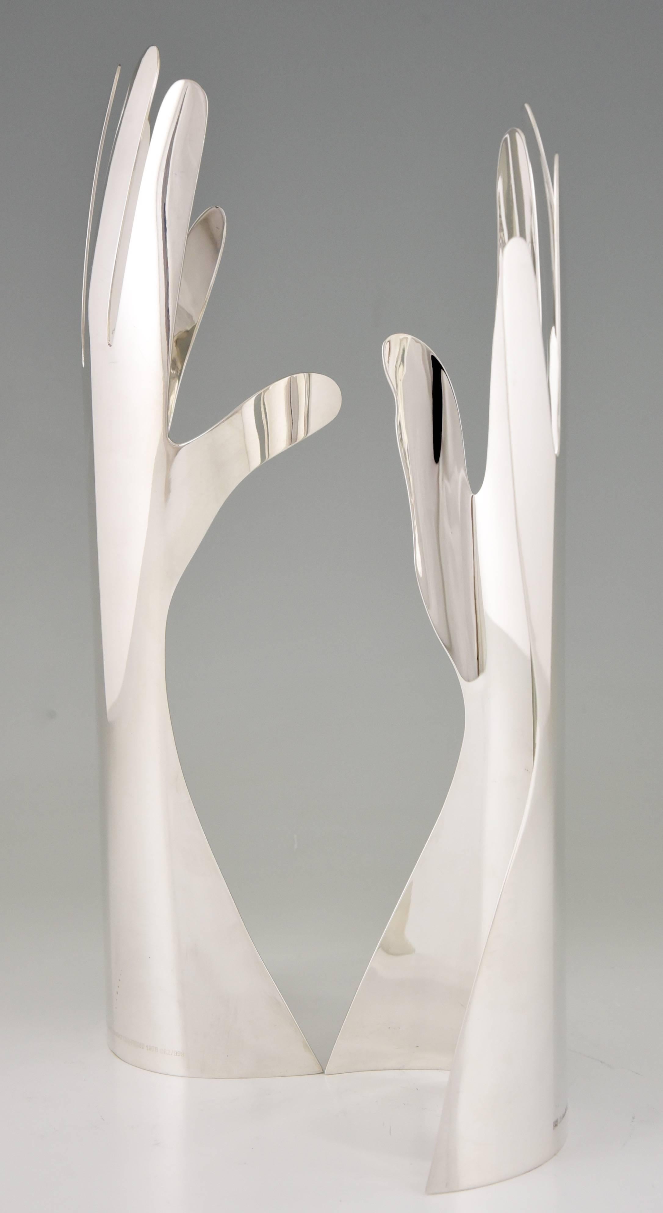 Le Mani or The hands.
A silver plated sculpture of two hands designed by Gio Ponti for Sabattini. One hand with five the other with six fingers. 
Desiged in 1978. 
First edition produced by Sabattini.
This is the limited edition produced by