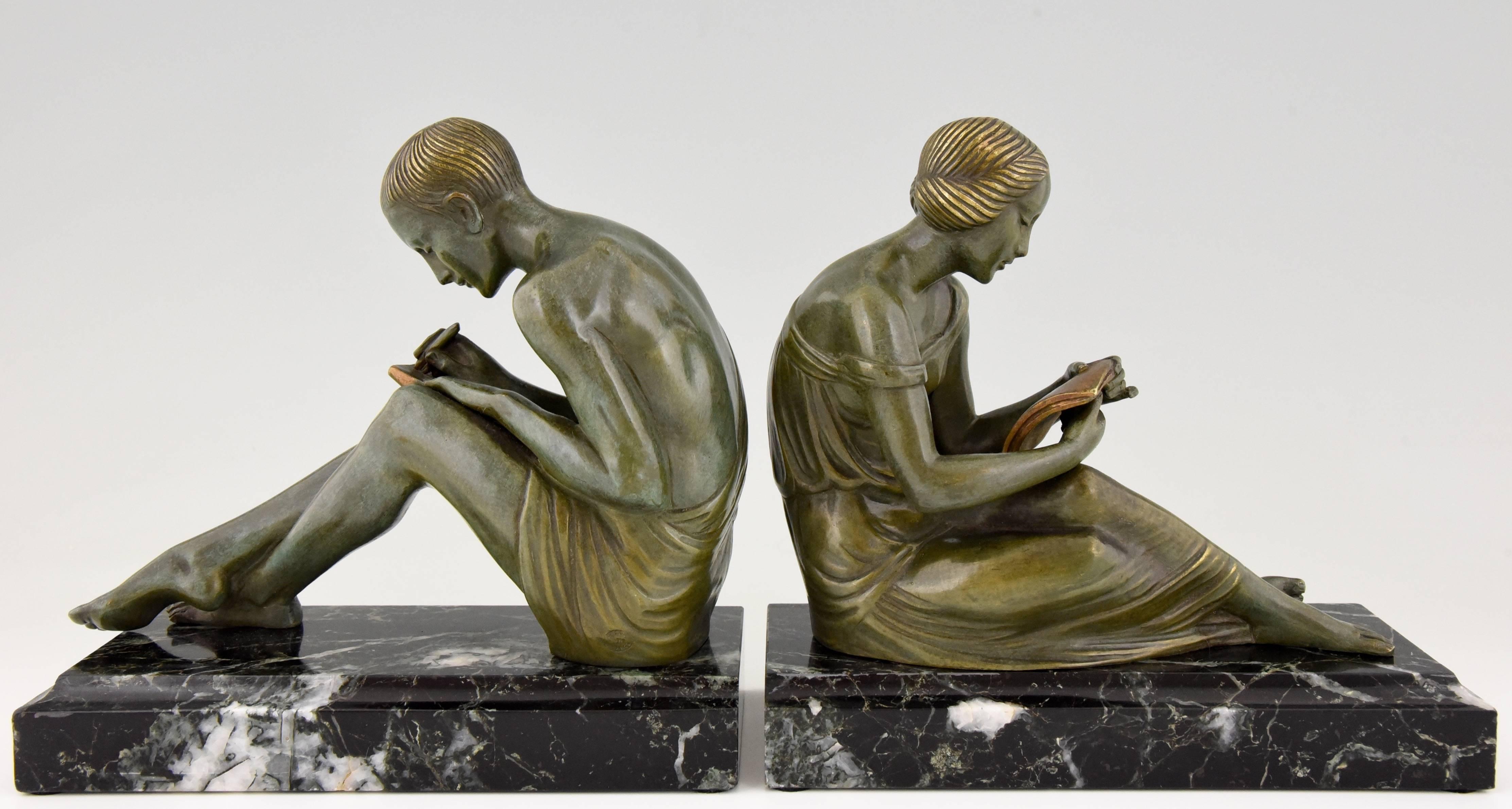 Hard to find pair of Art Deco bronze bookends with a young man writing a letter and a young woman reading it, beautiful patina on a green marble base. Signed by the French artist Pierre Le Faguays.

Artist / Maker:
Pierre Le Faguays.
Signature /