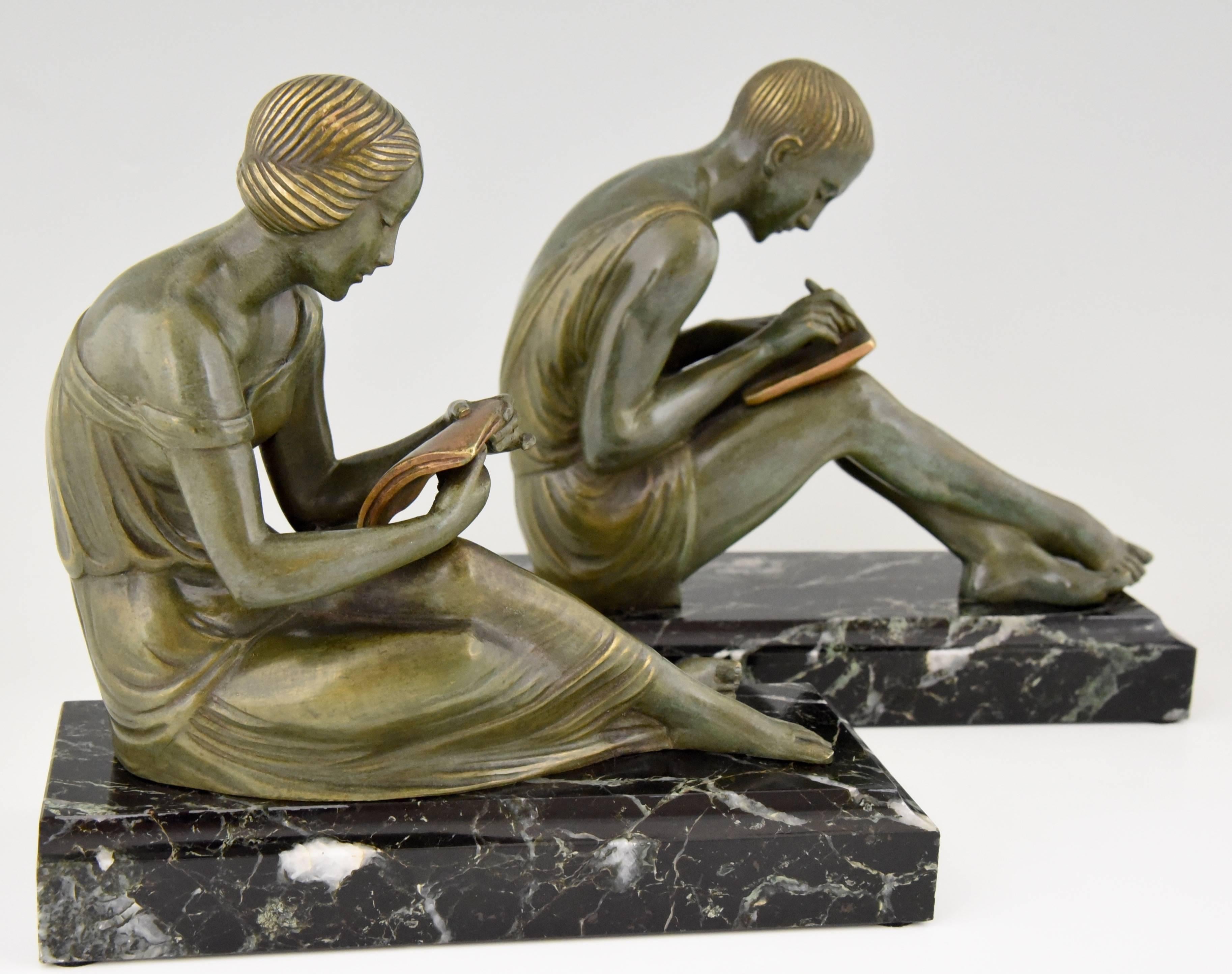 French Art Deco Bronze Bookends Man Writing Lady Reading Pierre Le Faguays, 1930 In Excellent Condition In Antwerp, BE
