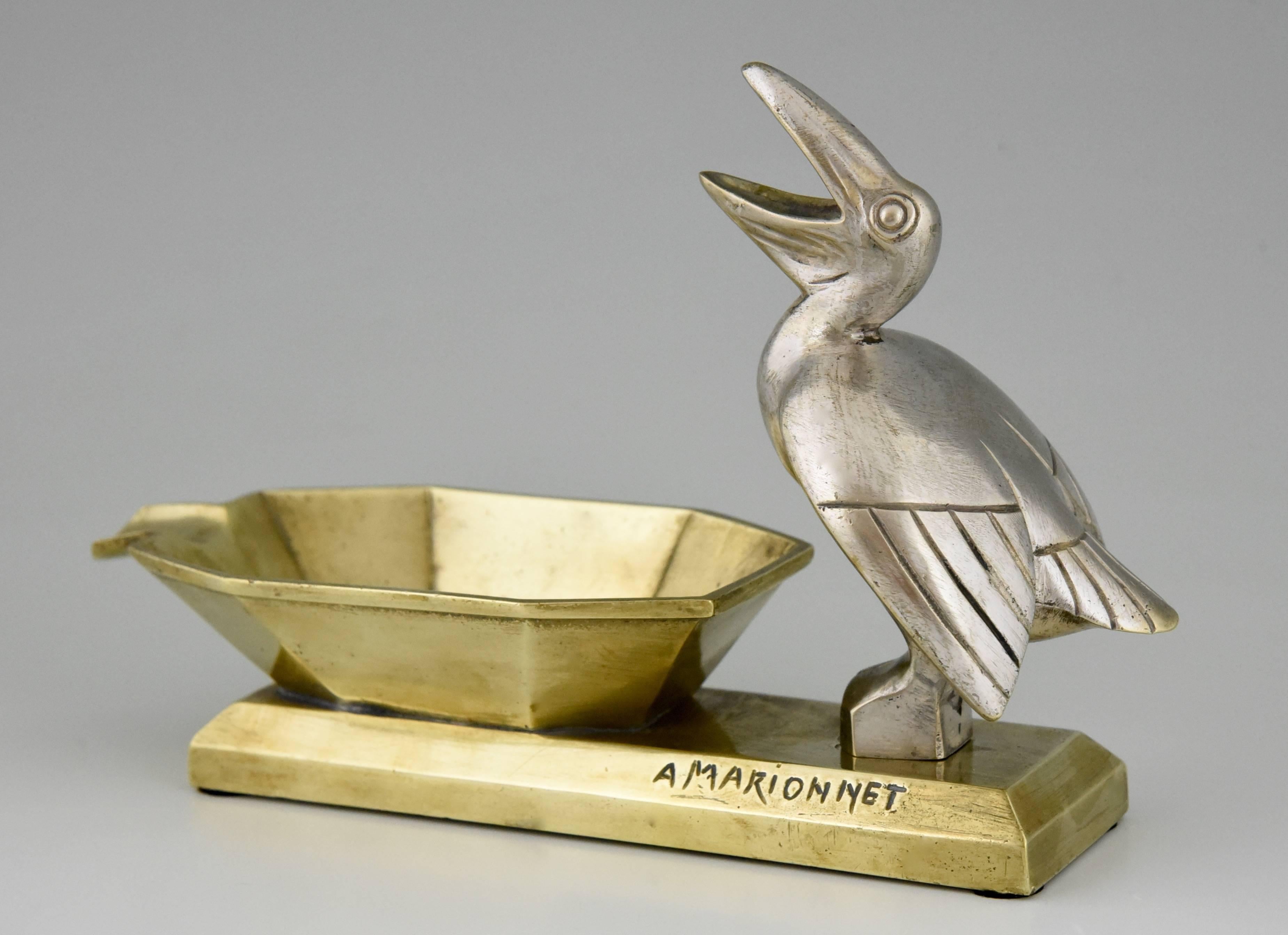 Rare Art Deco bronze ashtray with pelican by the French artist A. Marionnet.

Artist/Maker:
A. Marionnet.
Signature/Marks:
A. Marionnet.
Style:
Art Deco.
Date:
1925.
Material:
Bronze and silvered bronze.
Origin:
France.
Size cm:
H.
