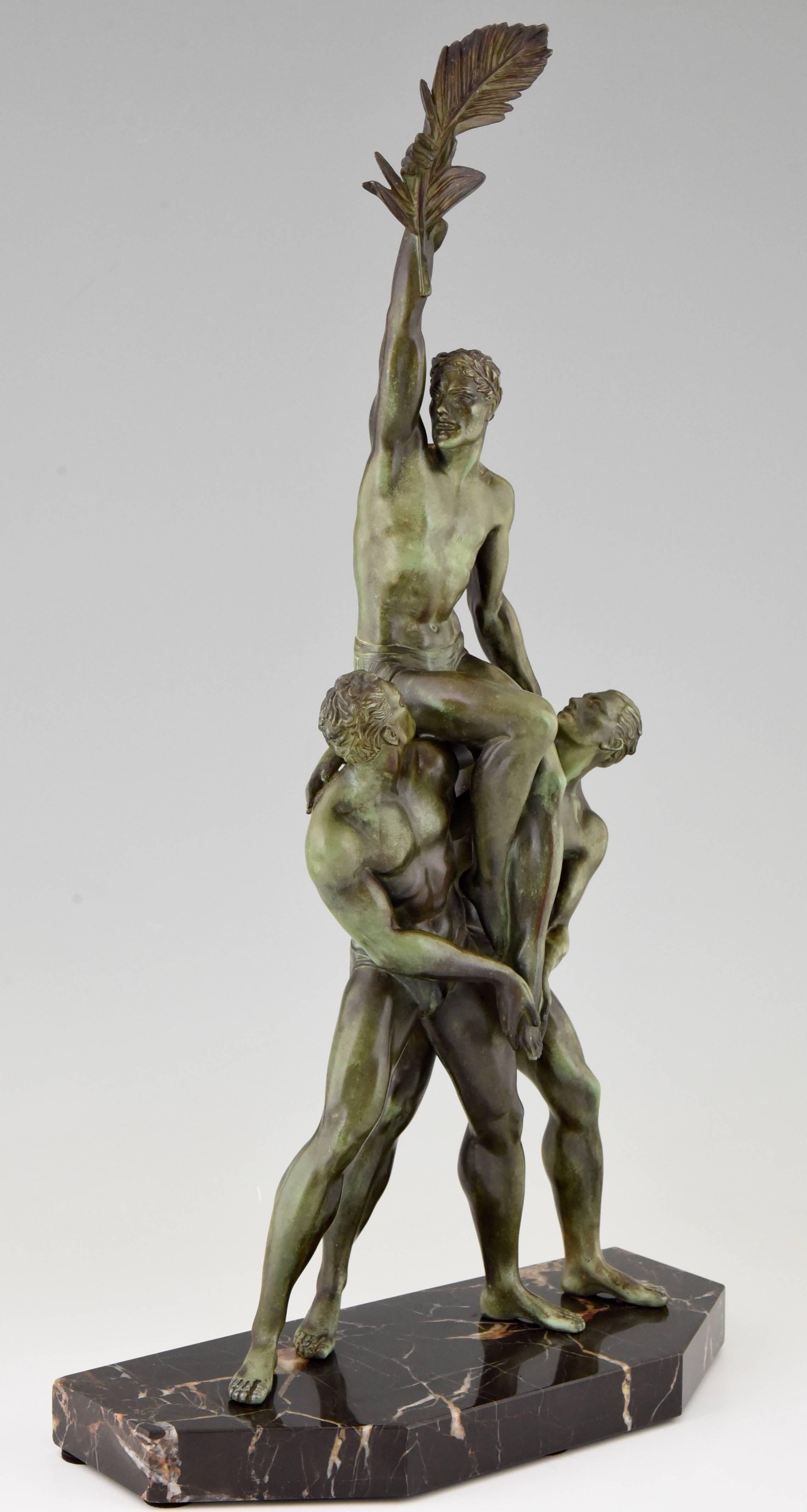 Typical Art Deco sculpture of three athletes by the well known French artist Pierre Le Faguays.

Artist / maker:
Pierre Le Faguays.
Signature / Marks:
P. Le Faguays. 
Style:
Art Deco.
Date:
1935.
Material:
Green patinated metal with