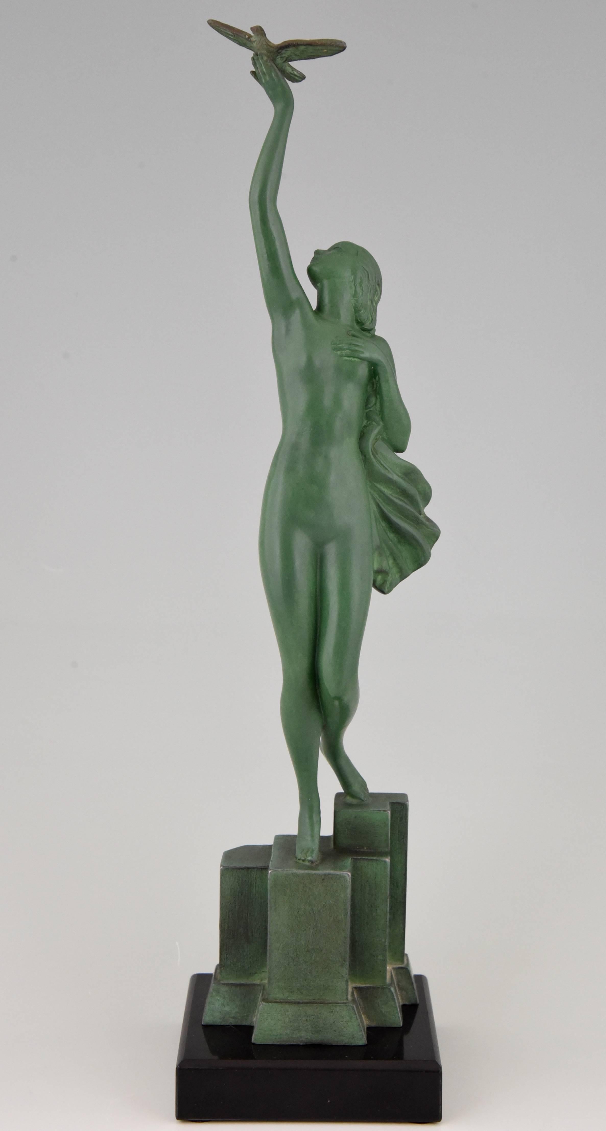Message of love, beautiful Art Deco sculpture of a nude holding a dove by the French artist Fayral, pseudonym for Pierre Le Faguays, on a marble base.

Artist/ Maker: Fayral, Pierre Le Faguays.
Signature/ Marks: Fayral.
Style: Art Deco.
Date: