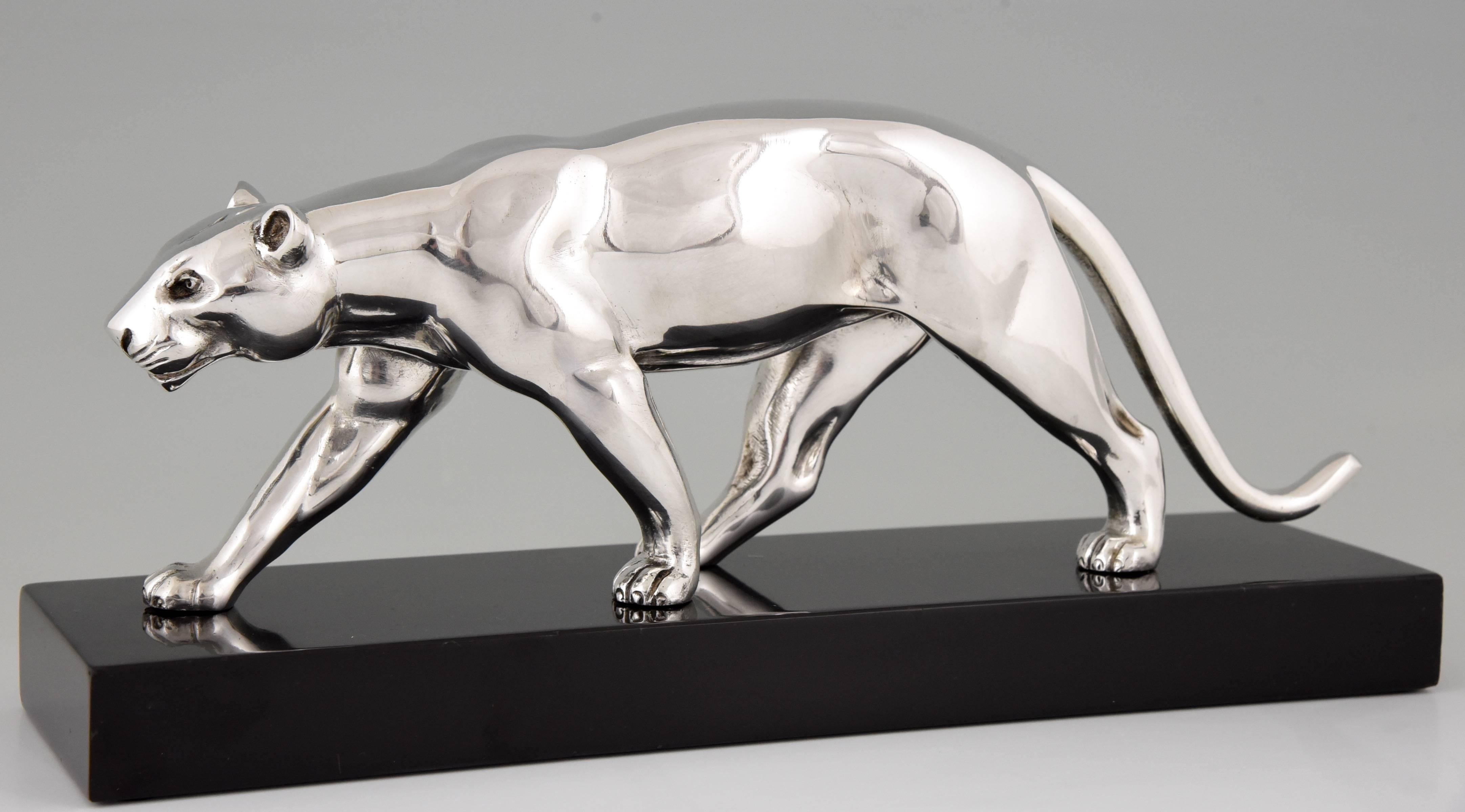 Artist/ Maker: Alexandre Ouline.
Signature/ Marks: Ouline.
Style: Art Deco.
Date: 1930.
Material: Silvered bronze on marble base.
Origin: France.
Size: L 32.5 cm. x H 14.5 cm x W 9 cm.  
L 12.8 inch X H 5.7 inch x W 3.5 inch.
Condition: