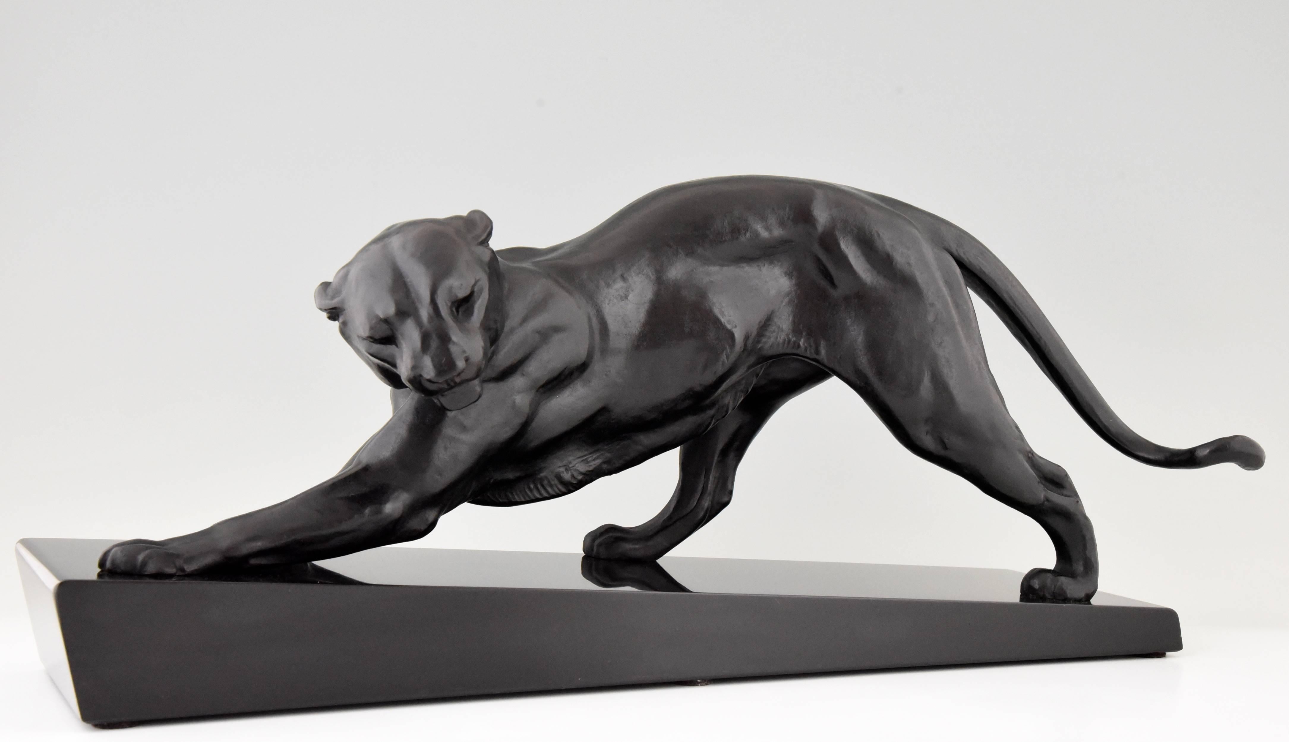 Art Deco panther on black marble base. 

Artist or maker: Plagnet.
Signature or marks: Plagnet.
Style: Art Deco.
Date: 1930.
Material: Patinated metal on marble base.
Origin: France.
Size: L 67.5 cm. x H 31 cm x W 21 cm.  
L 26.6 inch X H