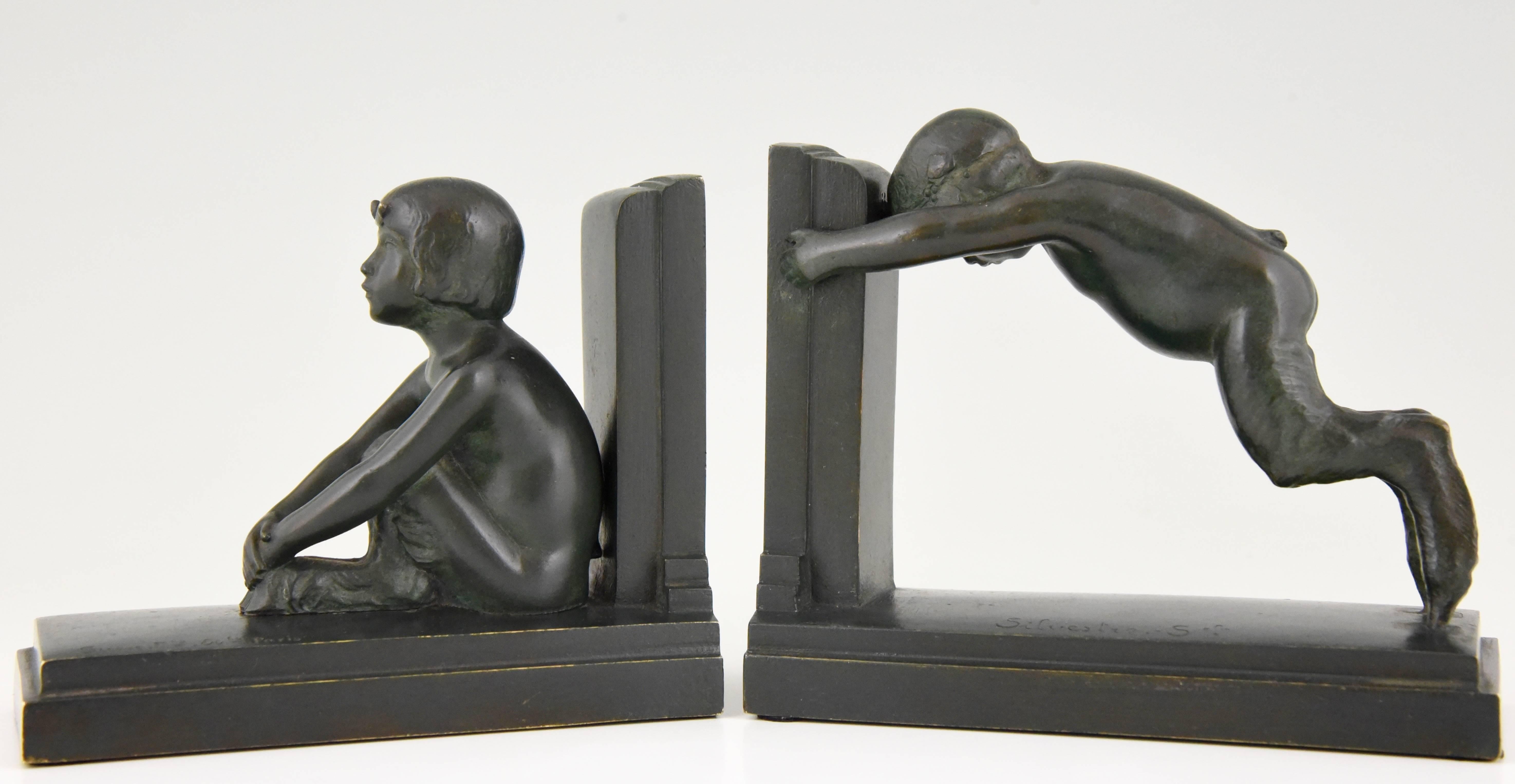 “Sit and push”
Lovely pair of Art Deco styled figures on bookends representing male and female satyr.

Reduced version of the “Miroir d’eau” fountains in Paris and Lucerne.
Artist/ Maker: Paul Silvestre.
Signature/ Marks: Silvestre, foundry