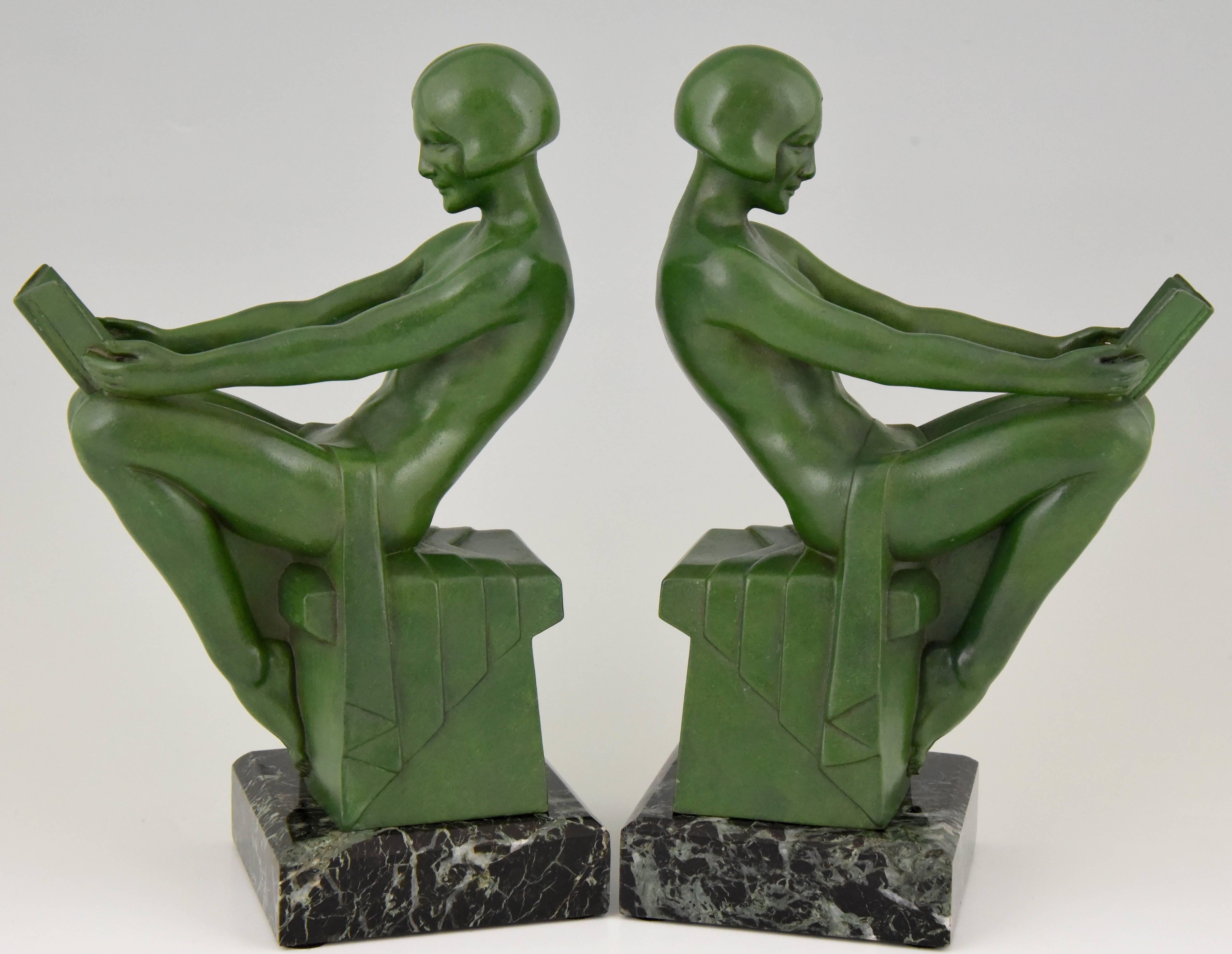 Very fine pair of Art Deco figural bookends modelled as reading nudes by the French artist Max Le Verrier.

Signature/ Marks: M. Le Verrier.
Style: Art Deco.
Date: 1930.
Material: Green patinated metal. Green marble base.
Origin: