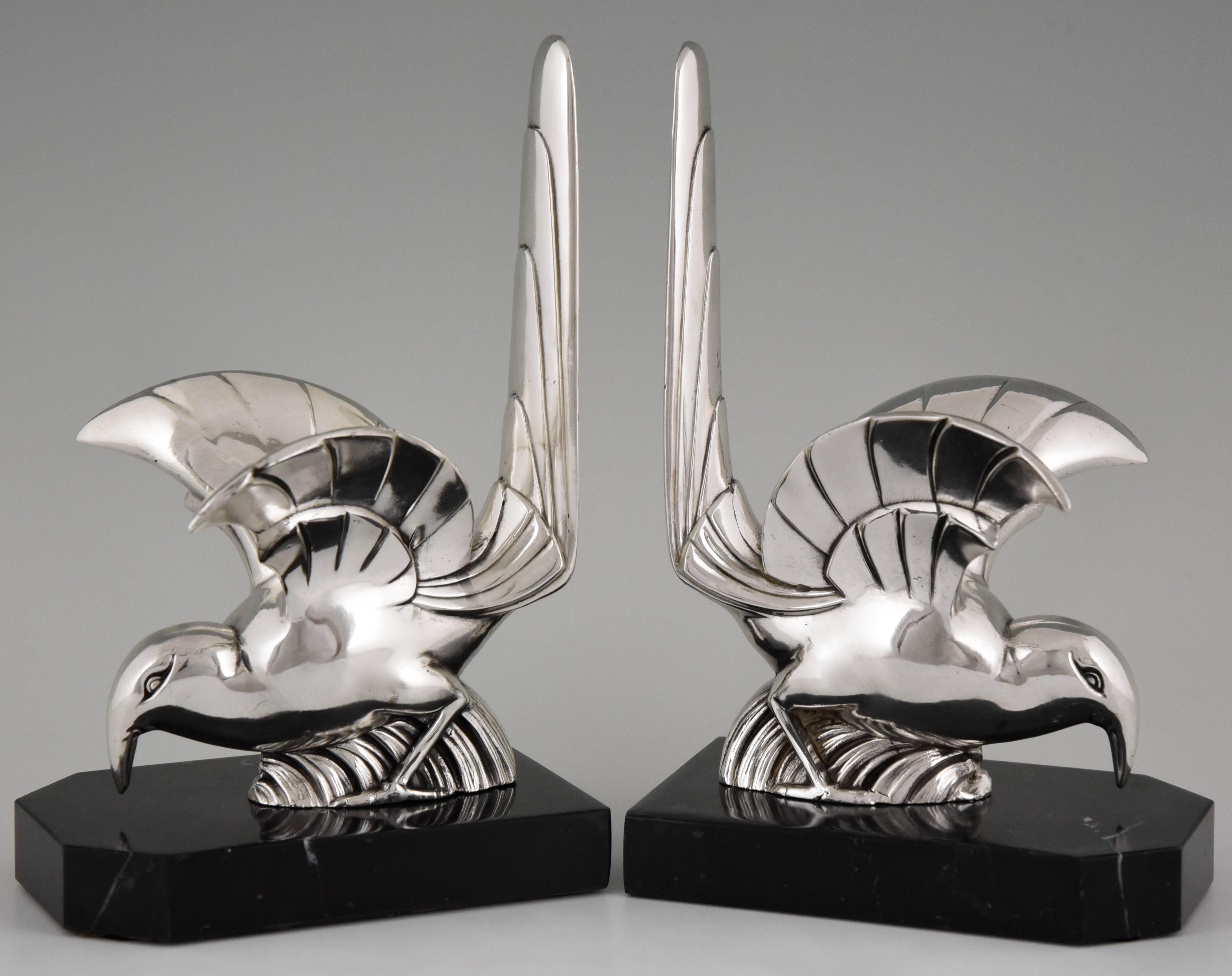 Artist/ Maker: F.H. Danvin
Signature/ Marks: Danvin
Style: Art Deco
Date: 1930
Material: Silvered art metal on black marble base.
Origin: France.
Size: H 20.5 cm x L 13 cm. x W 8 cm.
H. 8 inch. x L. 5.1 inch. x W. 3.1 inch.
Condition:
