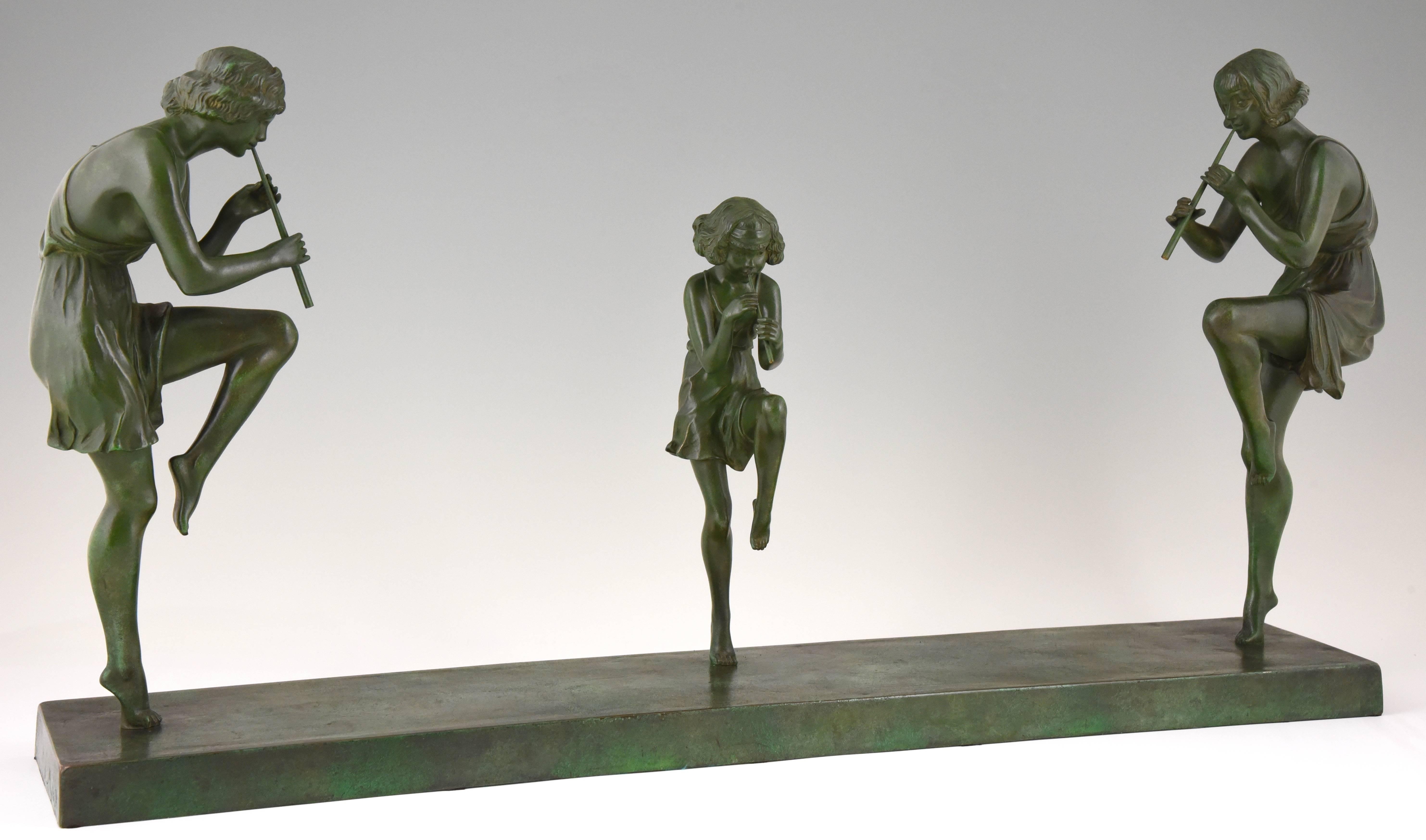 Art Deco bronze sculpture of three flute players.
Impressive bronze group of two young women and a young girl, wearing short floaty dresses, each balancing on one leg while playing a flute by Matto, Marcel Bouraine. 

Signature or Marks: Matto