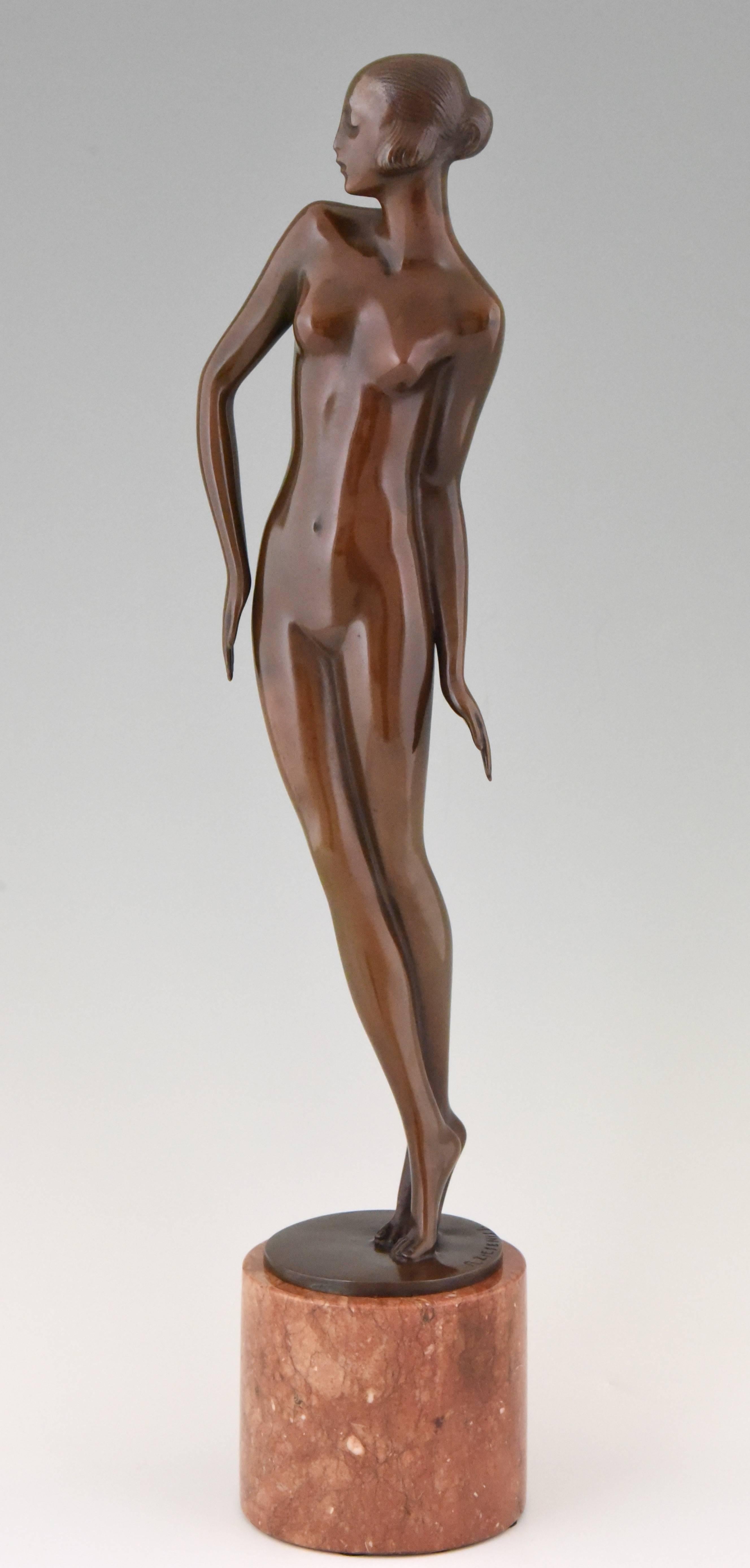 Very elegant tall Art Deco bronze sculpture of a standing nude by Rudolf Zieseniss, rich brown patina on marble base. 

Artist/ Maker: Rudolf Zieseniss
Signature/ Marks: R. Zieseniss.
Style: Art Deco.
Date: 1920
Material: Bronze, rich brown