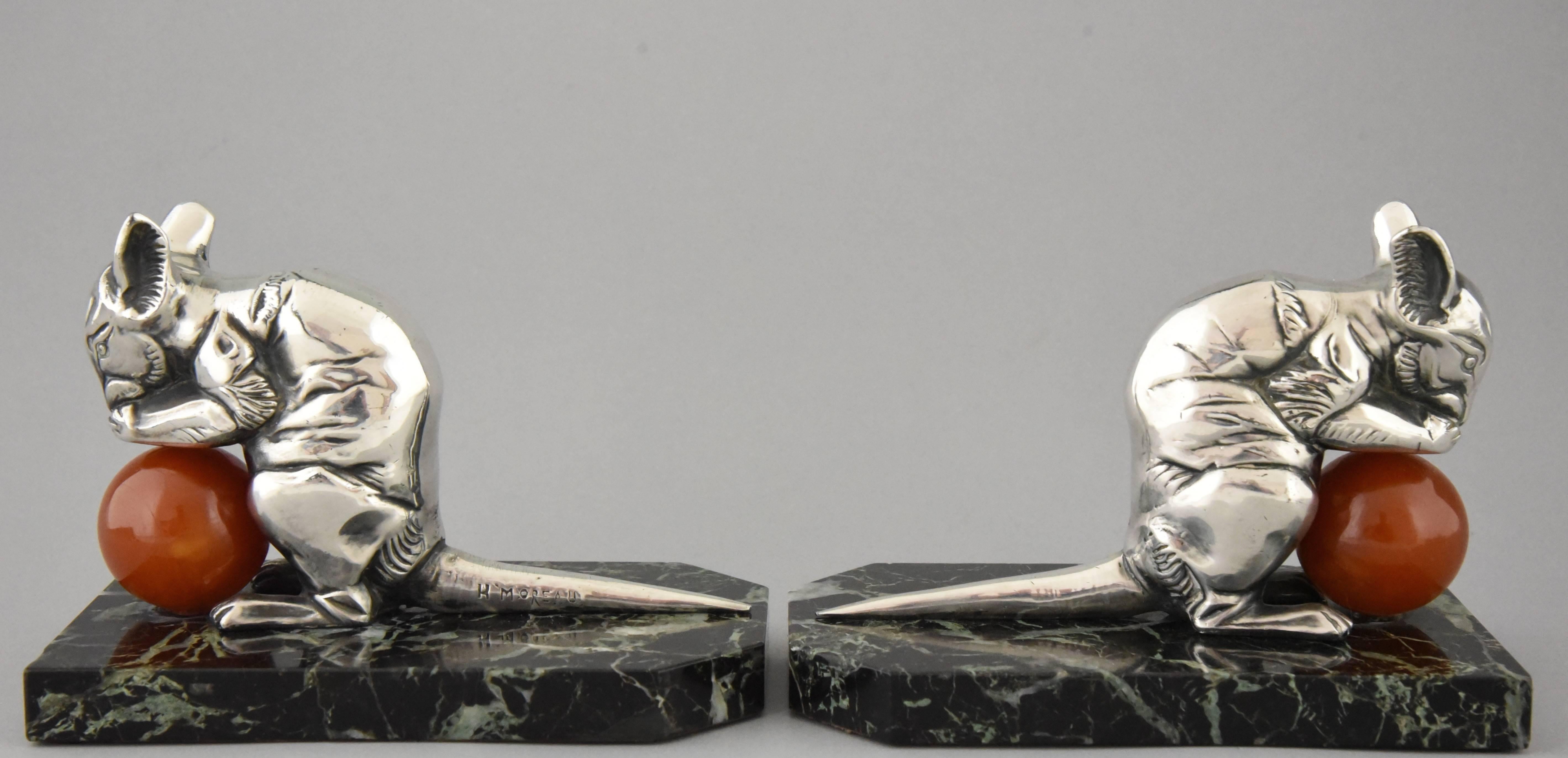 Lovely pair of French Art Deco mouse bookends by Hippolyte Moreau
Signature/ Marks: H. Moreau.
Style: Art Deco.
Date: 1930
Material: Silvered metal. ?Bakelite ball.? Marble base.
Origin: France
Size: H. 10.3 cm. x L. 14 cm. x W. 8.3 cm. ? 
H.