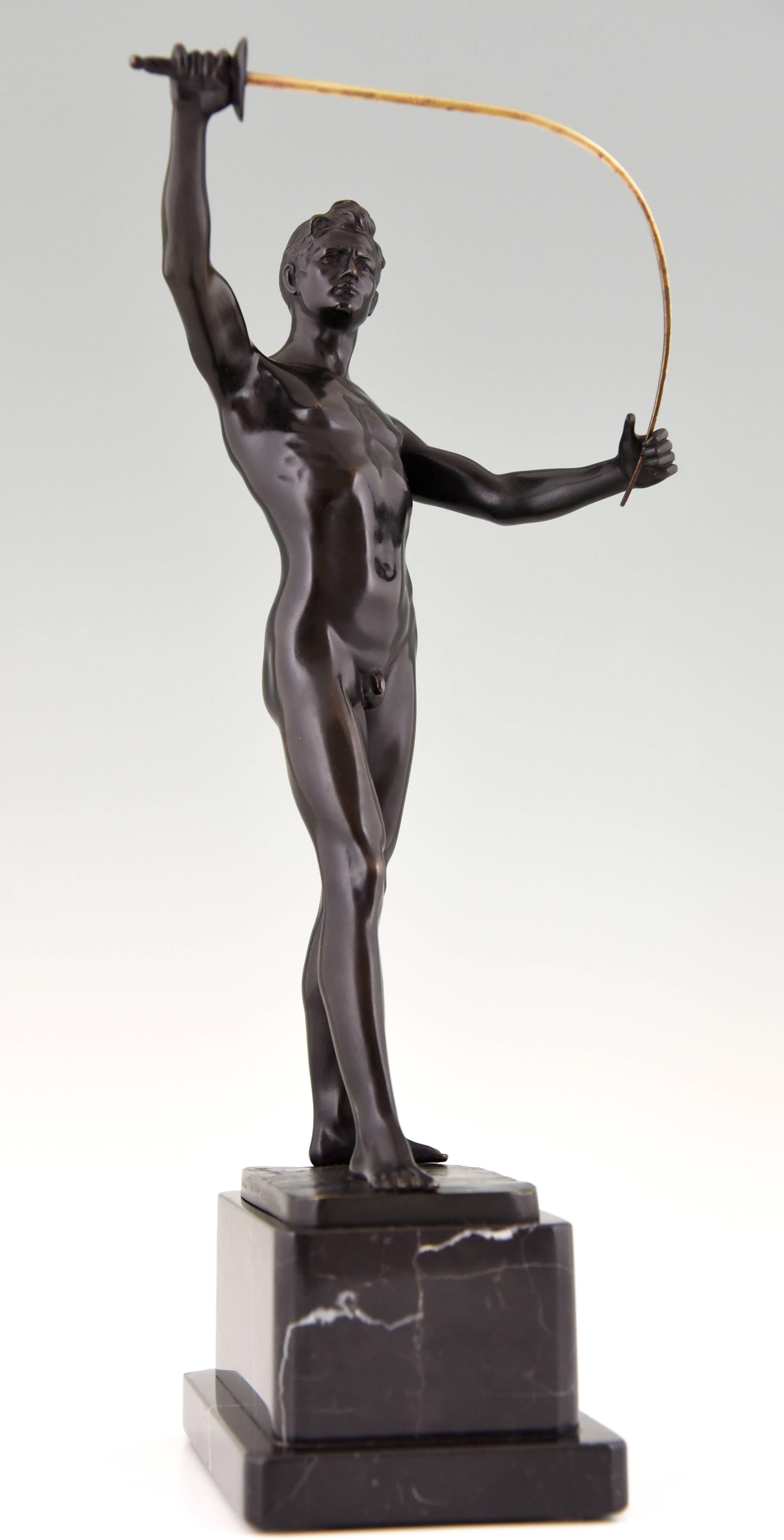 Art Deco sculpture of a standing male nude fencer holding and flexing an épée, on marble plinth. 

Artist/Maker: Auguste Durin
Signature/Marks: Auguste Durin.
Style: Art Deco
Date: 1920
Material: Patinated bronze. Marble base.
Origin: