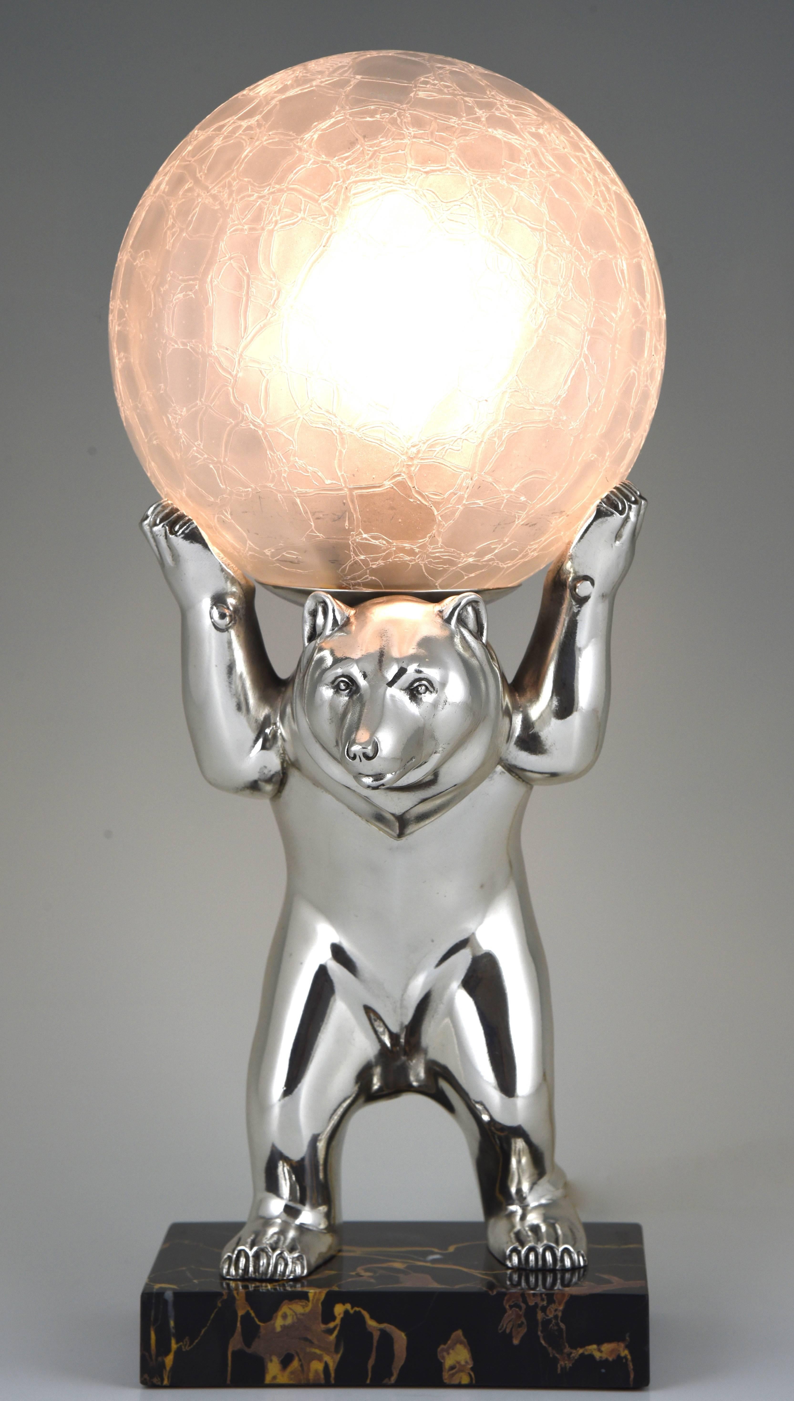 French Art Deco lamp modelled as a bear holding a glass globe. The sculpture is standing on a portor marble base. 

Artist/ Maker: Irenee Rochard
Signature/ Marks: I. Rochard.
Style: Art Deco
Date: 1930
Material: Silvered metal. Crackle glass