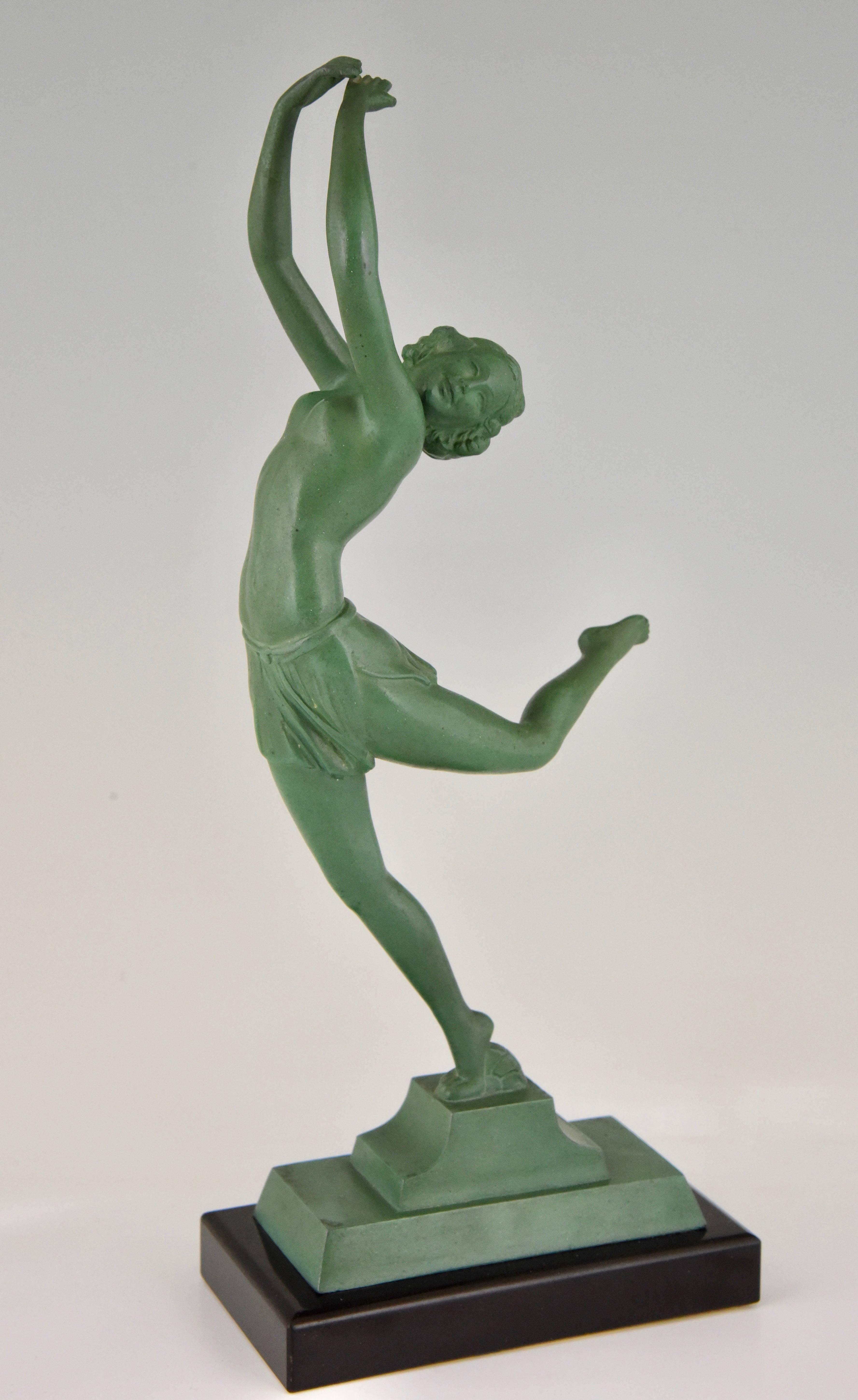 French Art Deco sculpture of a dancer on marble base, 1930

Style: Art Deco
Date: 1930
Material: Patinated art metal. On a black marble base.
Origin: France
Size: H. 32 cm x L. 14 cm. x W. 7 cm. ? 
H. 12.6 inch x L. 5.5 inch x W. 2.8