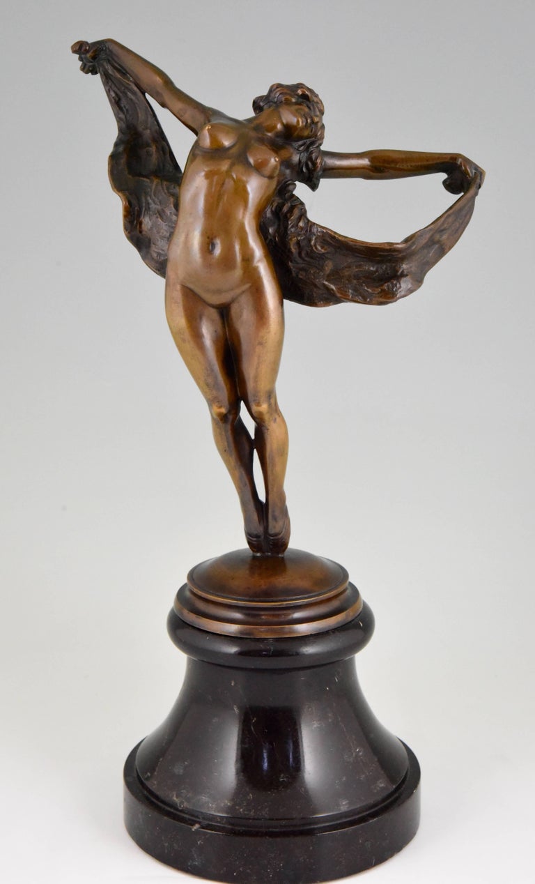 Art Nouveau bronze sculpture of a dancing nude.
Artist/ Maker: Joseph Zomers
Signature/ Marks: J. Zomers
Style: Art Nouveau.
Date: 1915
Material: Patinated bronze. ?Marble base.
Origin: Belgium
Size: H. 43.5 cm x L. 24 cm. x W. 17 cm. ? 
H.