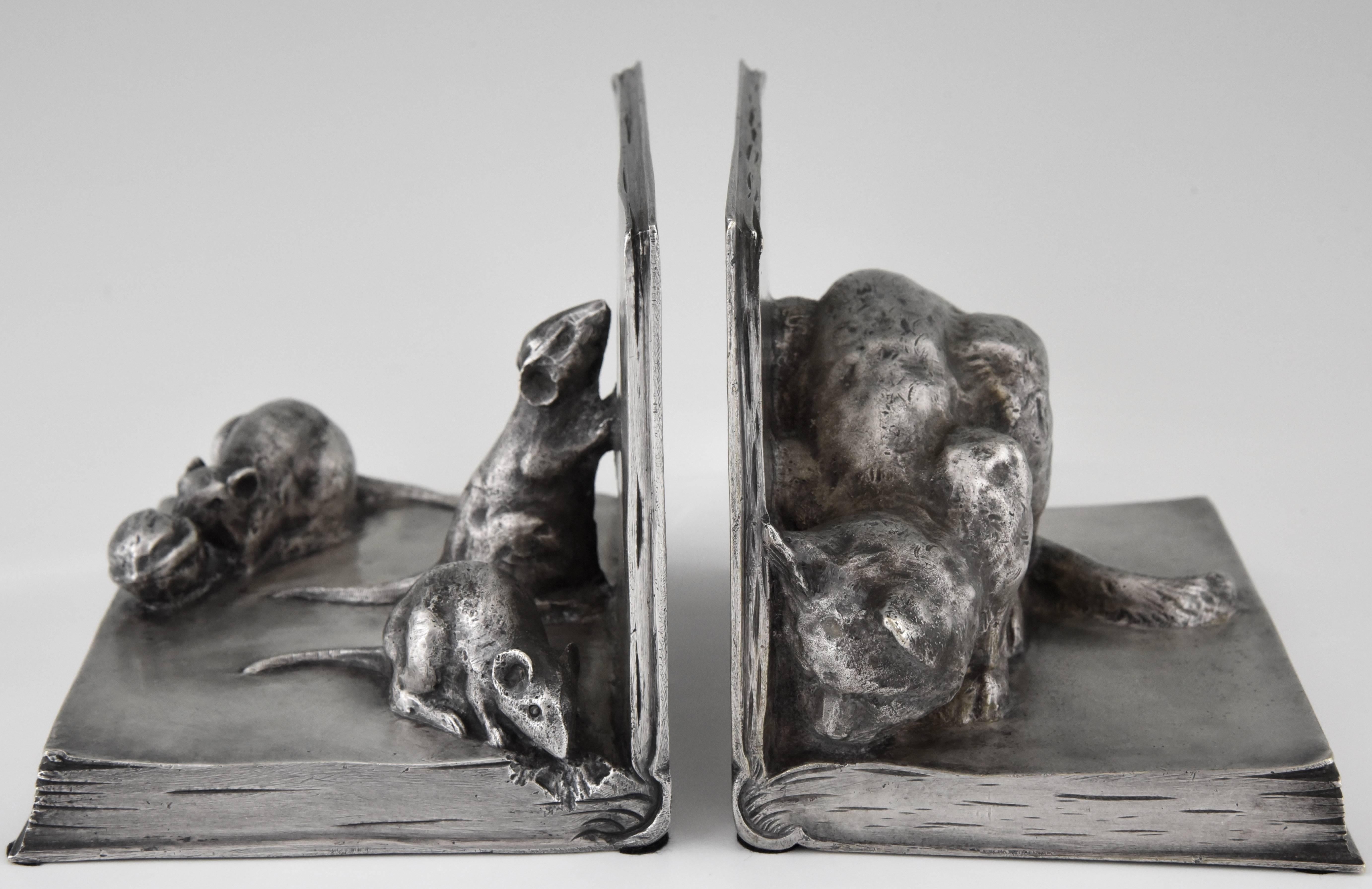 Art Deco bronze bookends, cat and mice on books by A. Duchêne
Signature/ Marks: A. Duchêne.
Style: Art Deco
Date: 1920
Material: Bronze with old silver patina.
Origin: France
Size: H 11.5 cm. x L 16 cm. x W 11 cm.? each 
H 4.5 inch x L 6.3