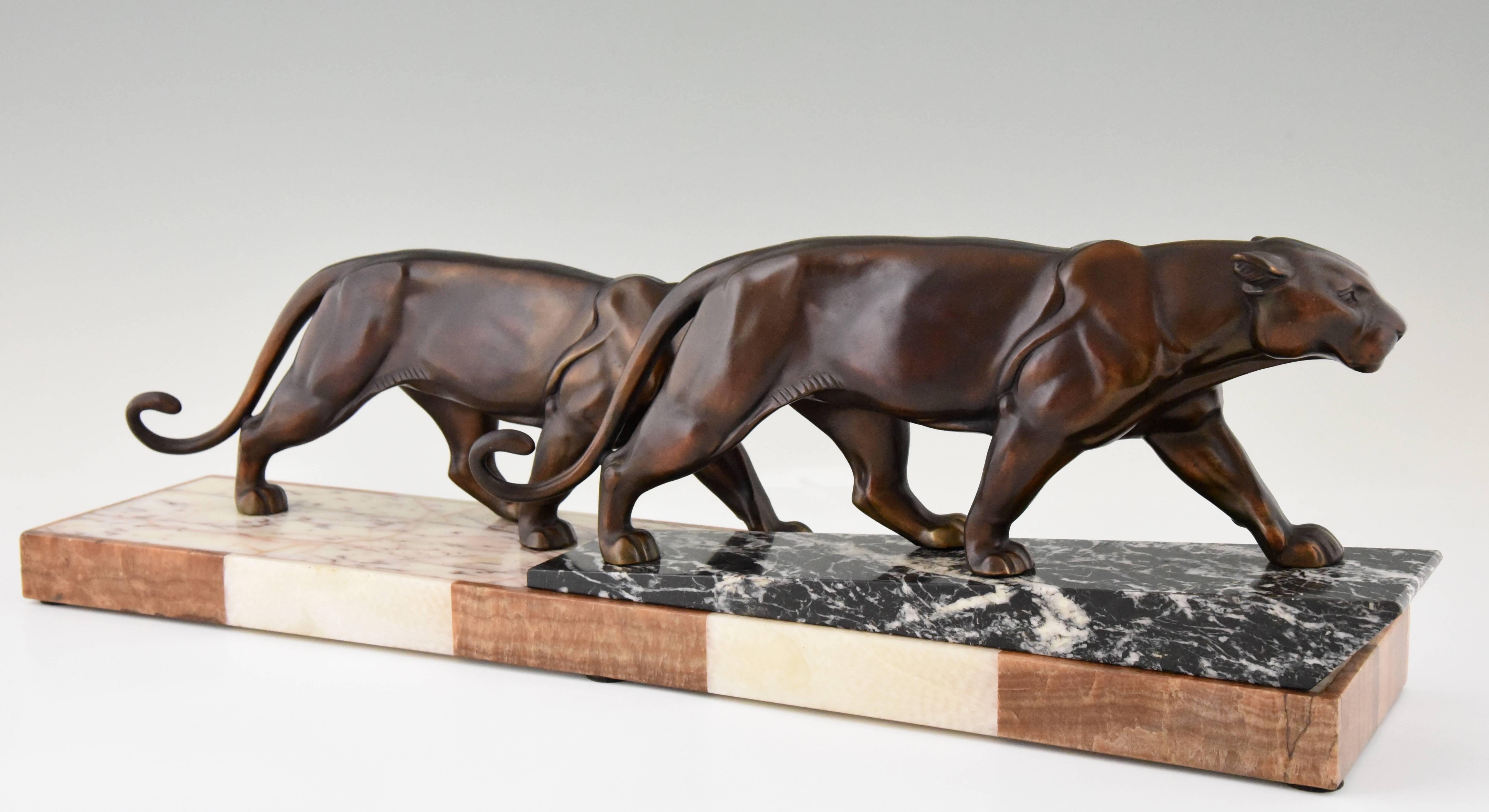 Patinated Art Deco Sculpture of Two Walking Panthers by Alexandre Ouline, 1930 France