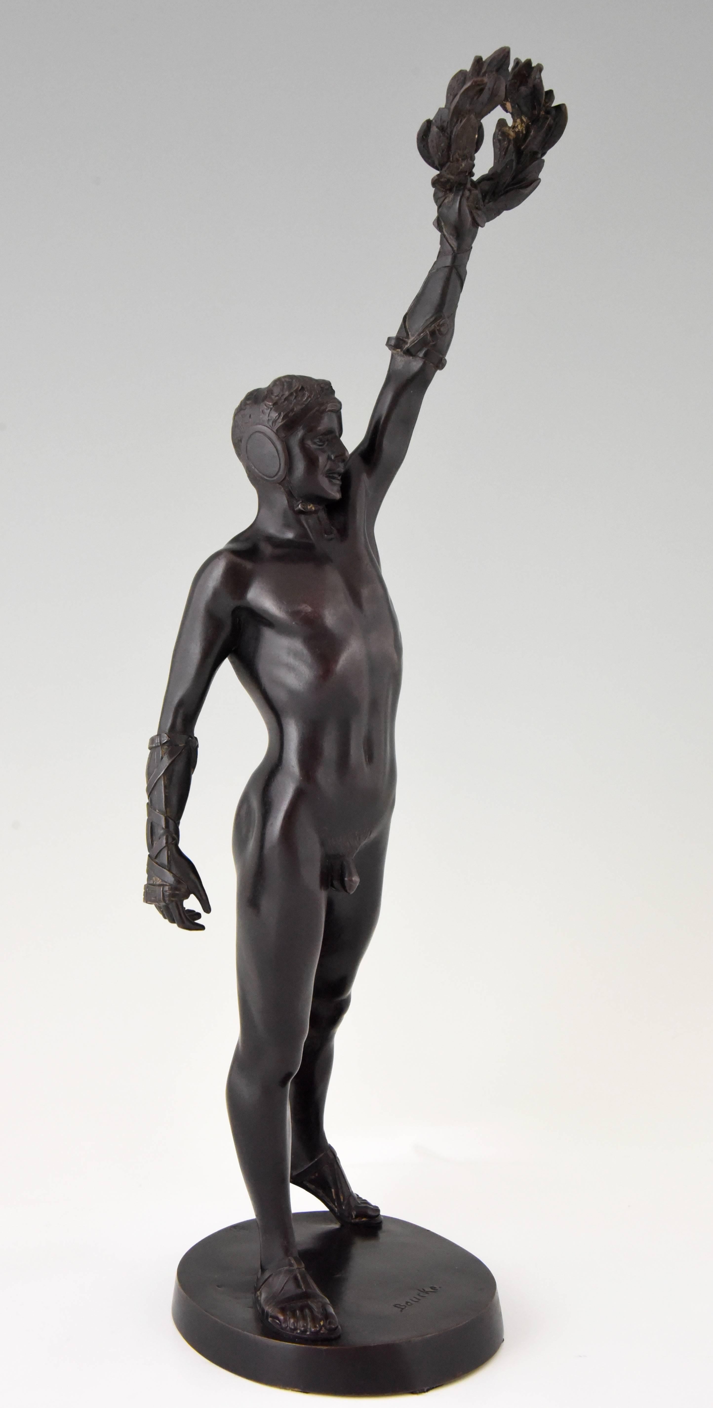 The Victorious Boxer, antique bronze sculpture male nude boxer with laurel wreath by Heinrich Baucke. 

Heinrich Baucke, born in Germany in 1875, died in 1915.
This bronze is also in the collection of the Berlin and in the Kunsthalle in