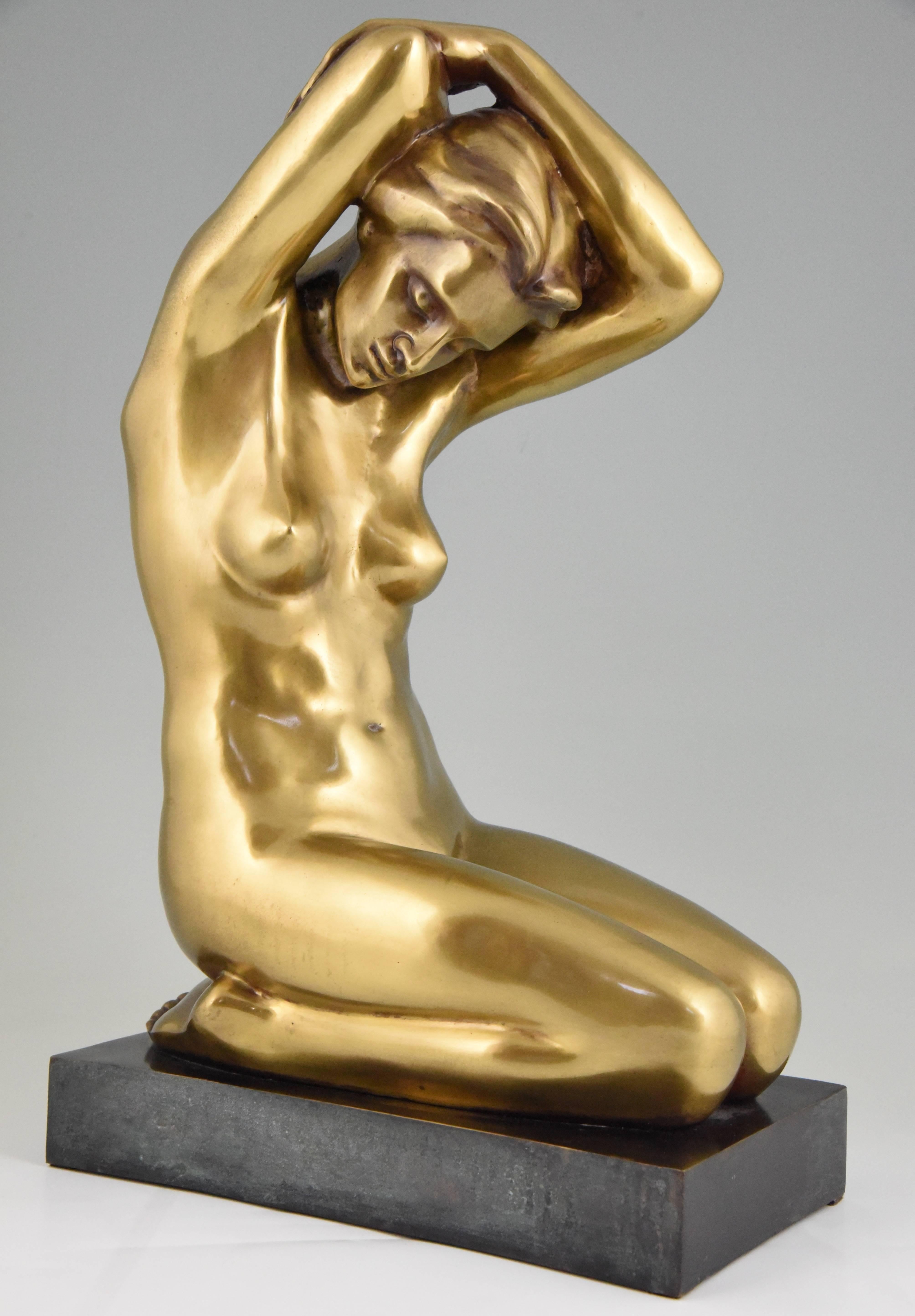 Elegant Art Deco bronze sculpture of a naked woman sitting on her knees with her arms over her head. This unsigned figurine is in the style of Arno Breker, a German artist who specialized in nudes.
Style: Art Deco
Date: 1930
Material: Patinated