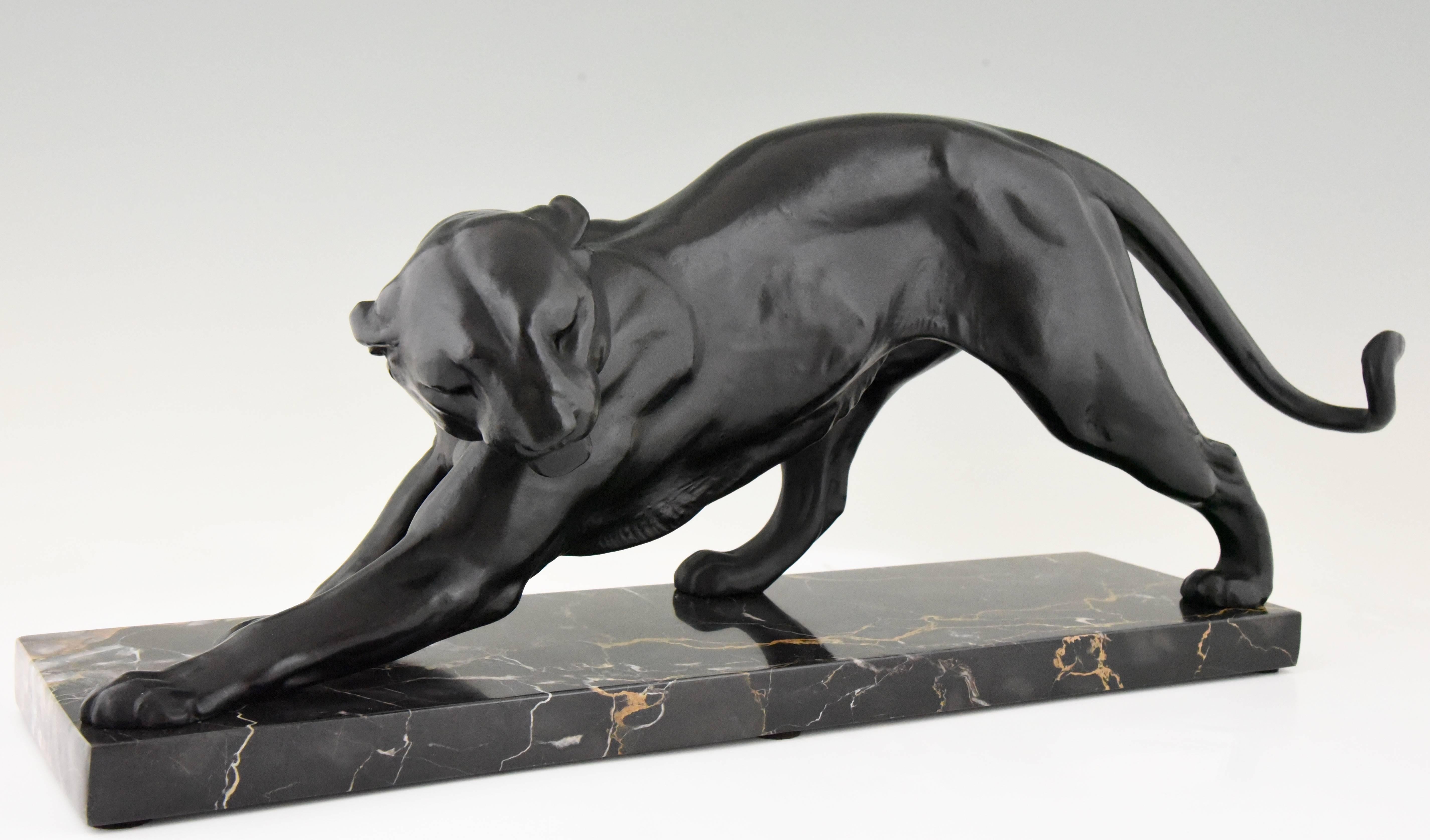 Elegant Art Deco sculpture of a black panther on a Belgian black marble base by Plagnet. Signature/ Marks: Plagnet
Style: Art Deco
Date: 1930
Material: Patinated metal on marble base.
Origin: France
Size: L. 62.5 cm. x H. 28 cm x W. 23 cm.?
L.