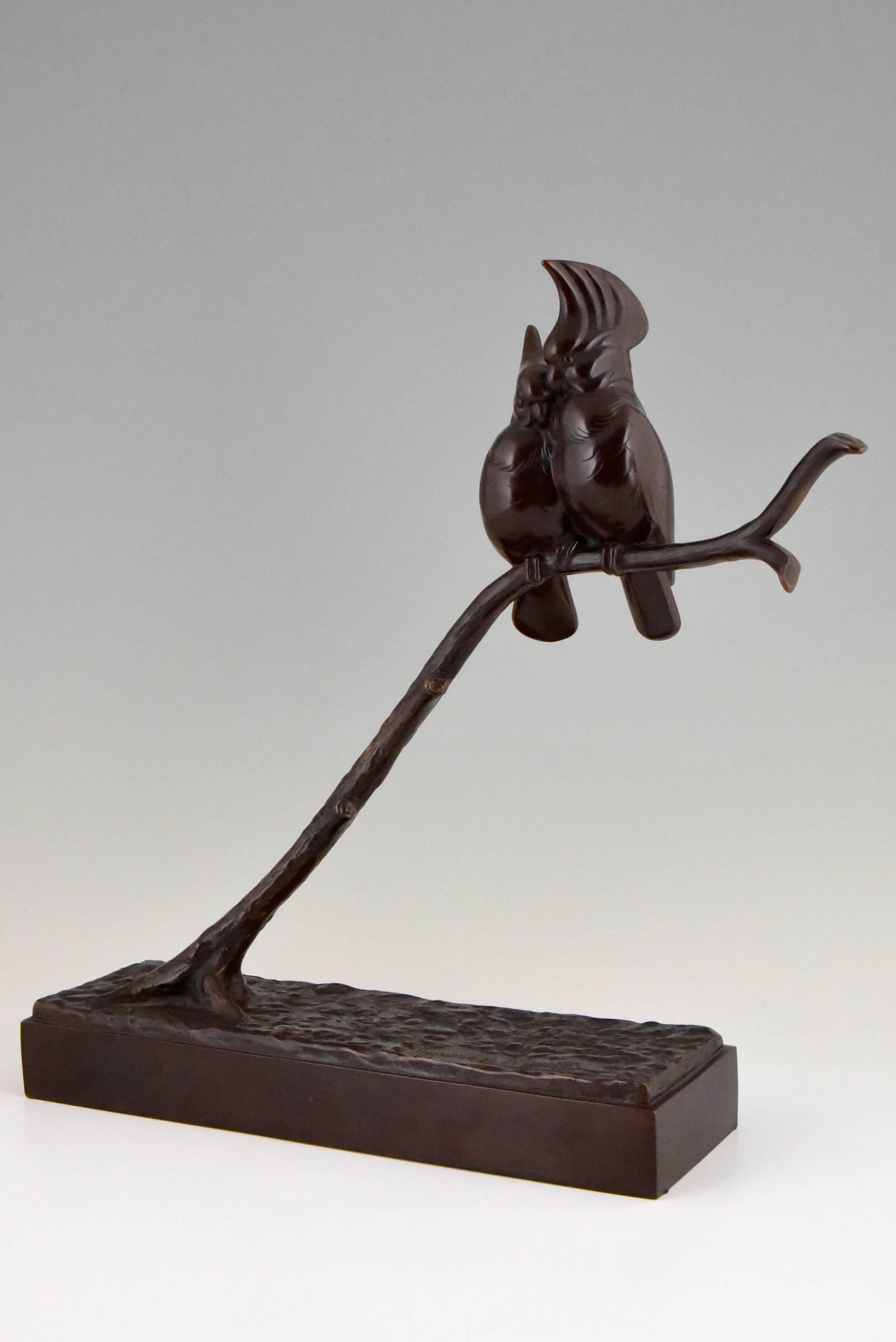 Patinated Art Deco Bronze sculpture of Two Birds by Raymond de Meester de Betzenbroeck.