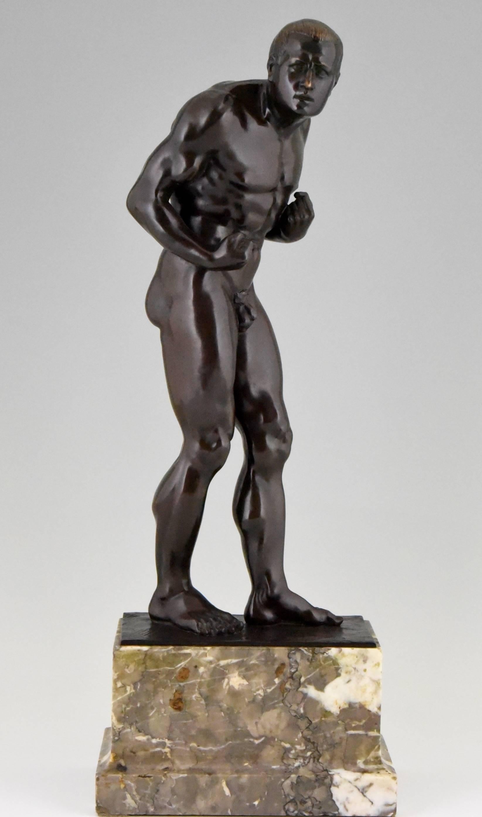 The boxer by Otto Feist, born in Germany 1872. 
Signature/ Marks:   O. Feist.  1906  and Foundry mark. 
	
Material: Bronze with very dark brown patina.  Marble base. 	
Origin:  Germany.			

Size:			 
H. 52 cm. x L. 19.5 cm. x W. 11.6 cm.