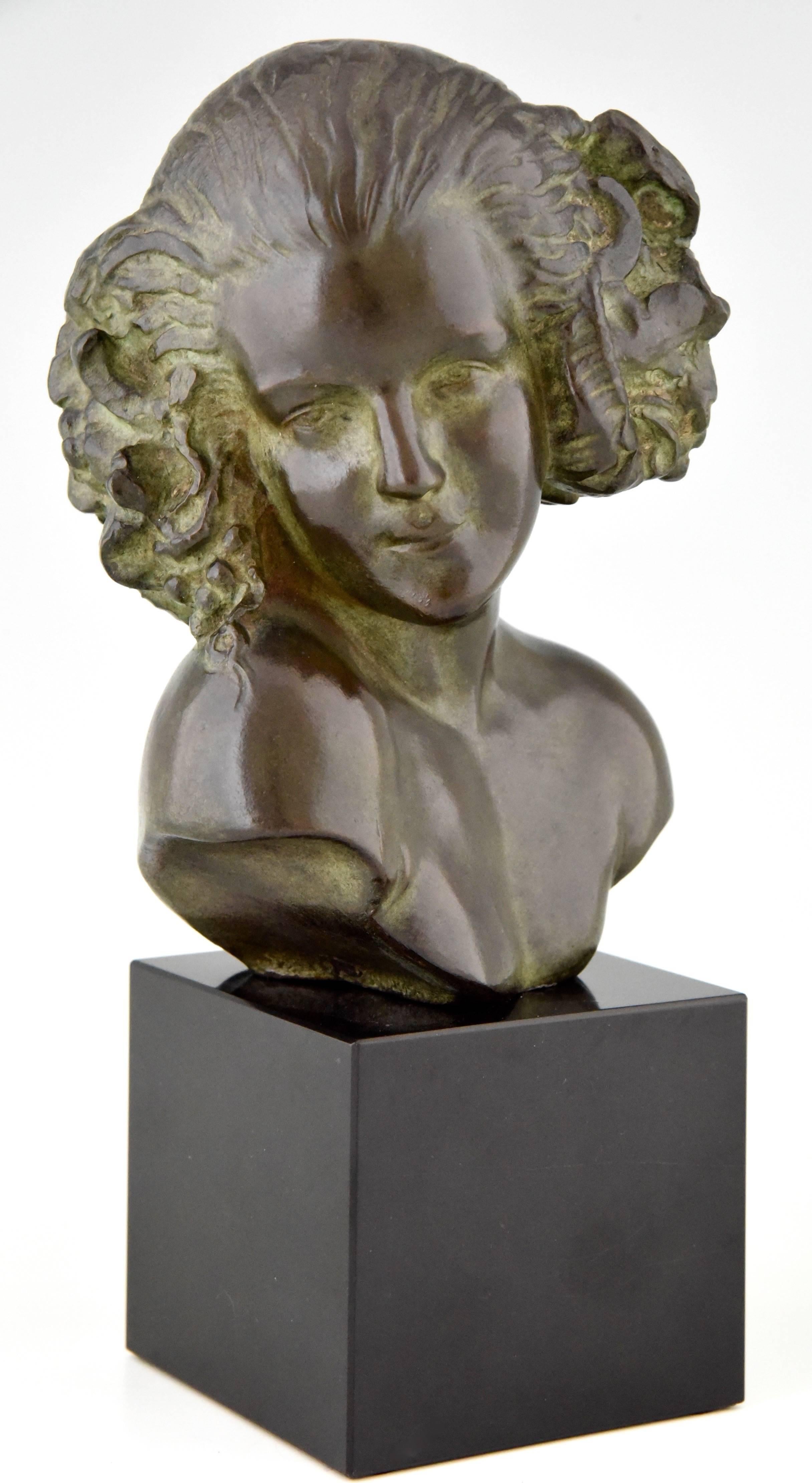 Art Deco bust of a female satyr by Maxime Real del Sarte, 1888-1954.
Signature:  Real del Sarte. 
Style:  Art deco
Date:  circa 1930.
Material:  Dark green patinated bronze. Marble base. 
Origin:  France.
Size:  
H. 10.4 inch x L. 5.3 inch x