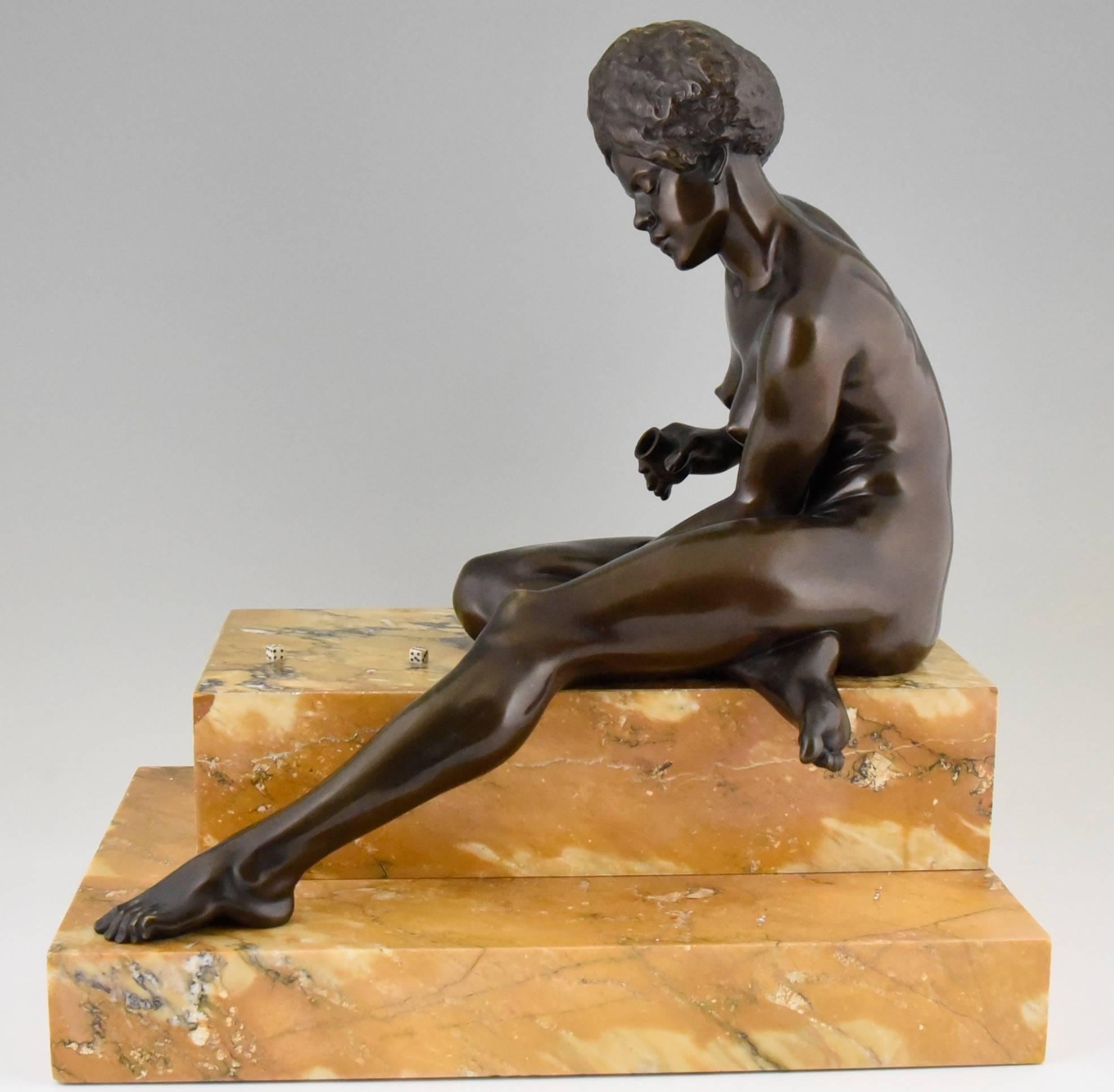 Bronze sculpture of an African nude playing dice.
By ?Clarisse Levy Kinsbourg (Born in France in 1896).
Signature: C. Levy Kinsbourg.
Style: Art Deco.
Date: circa 1930.
Material: Patinated bronze.? Marble base.
Origin: France.
Size:
H. 51