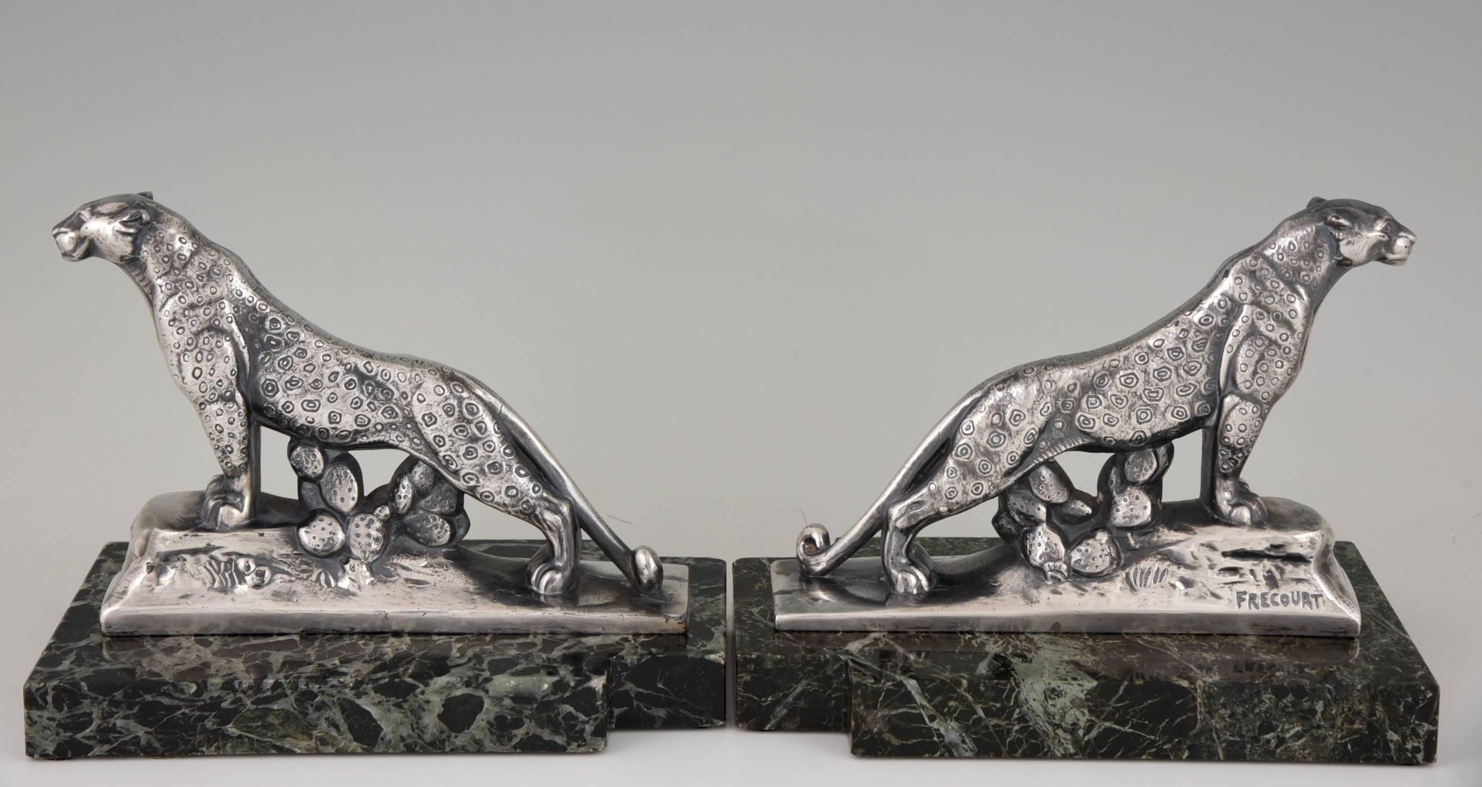 Description:  A pair of Art Deco panther bookends.
Artist/ Maker: Maurice Frecourt.
Signature/ Marks: Frecourt.
Style:  Art Deco. 
Date:  circa 1930. 
Material:  Metal with silver patina. On green marble bases. 
Origin:  France. 
Size:  
H