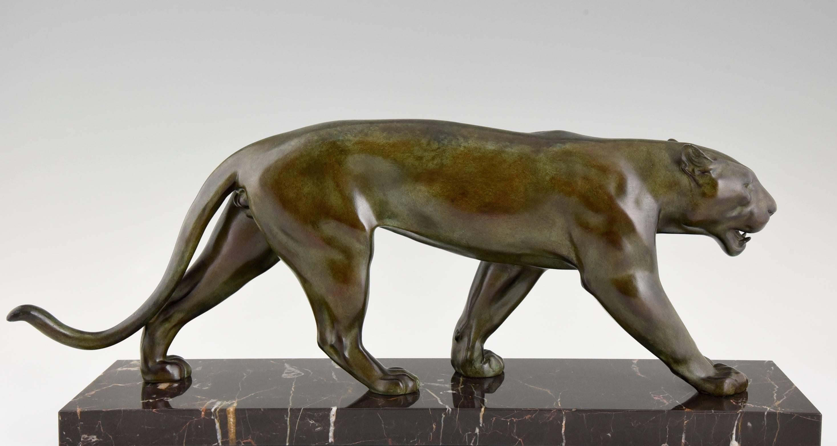Description:  Art Deco sculpture of walking panther. 
Artist / Maker: Max Le Verrier. 
Signature:  M. Le Verrier. 
Style:  Art Deco.		
Date:  1930/1940.
Material: Patinated metal. Marble base. 
Origin:  France.			
Size:		 
 H. 9.8 inch x L.