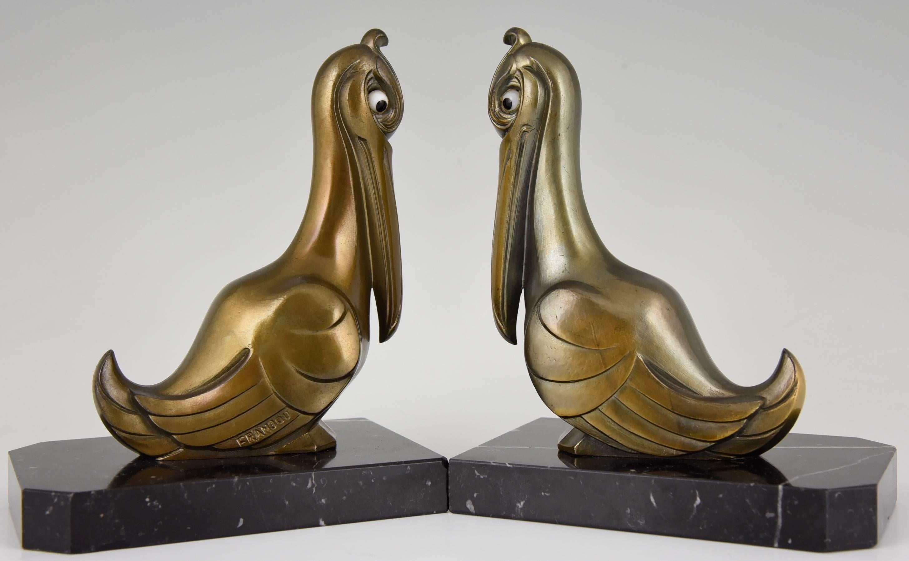 Description: Pelican bookends.
Artist/ Maker: Franjou. 
Signature/ Marks:  Franjou. 
Style: Art Deco
Date: circa 1930.
Material: Patinated white metal.  Marble base.
Origin: France. 
Condition:  Very good condition.  
Size of one: 
H 5.9