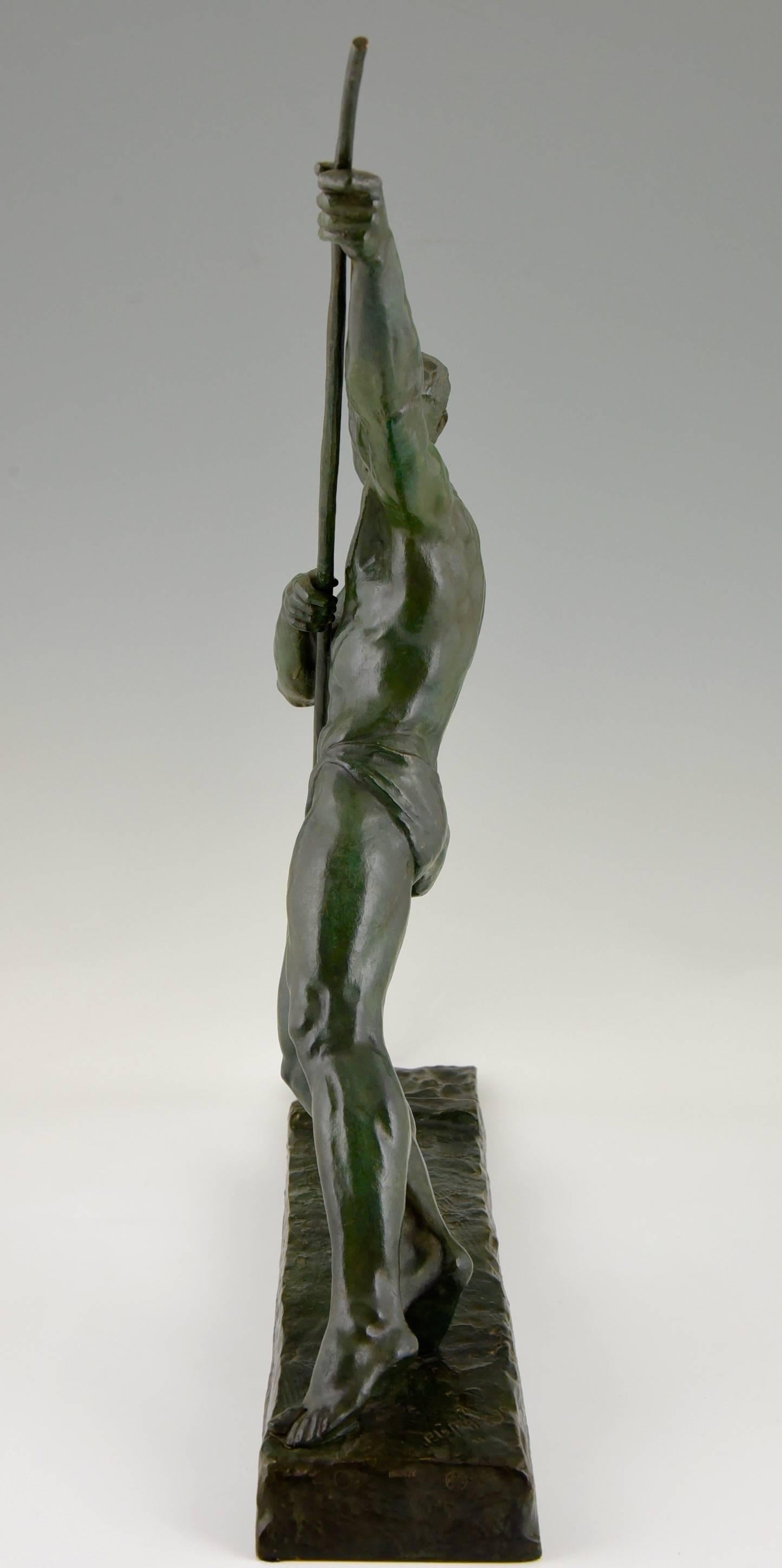 Patinated Pierre Le Faguays Art Deco bronze sculpture of an athlete with pole, 1925