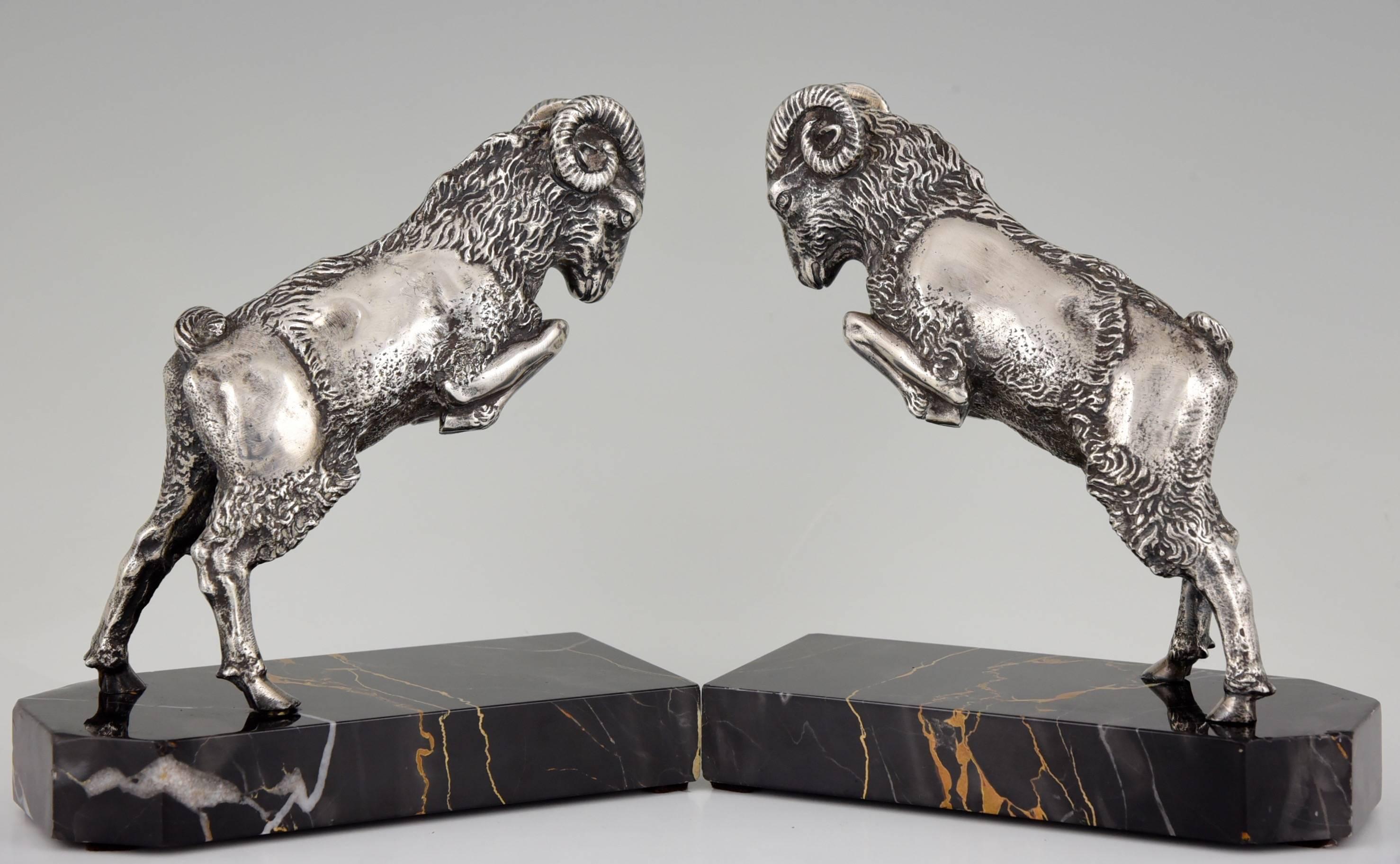 Description:  Art Deco bronze ram bookends.
Artist / Maker: Scribe.
Signature / Marks:  Scribe.
Style:  Art Deco. 
Date:  circa 1925/1930.
Material:  Bronze with silver patina on marble base. 
Origin:  France. 
Size of one:  
H 7.5 inch x L