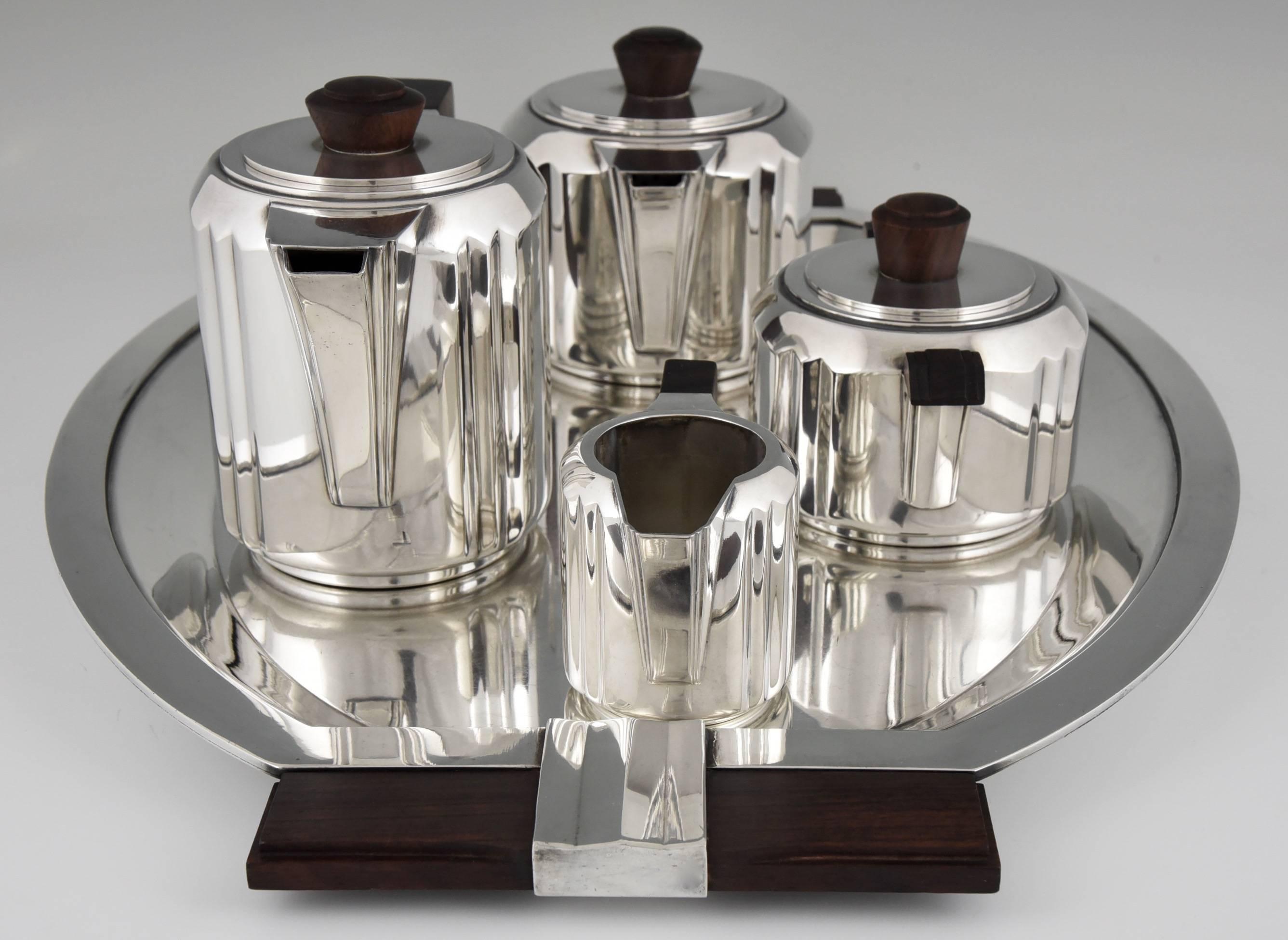 Description:  
Service “Panneaux plissés” 
5 piece Art Deco tea and coffee set.  
This set is also in the collection of the Musée Bouilhet Christofle

Artist/ Maker:  Designed by Luc Lanel.  Executed by Christofle. 
Signature/ Marks: