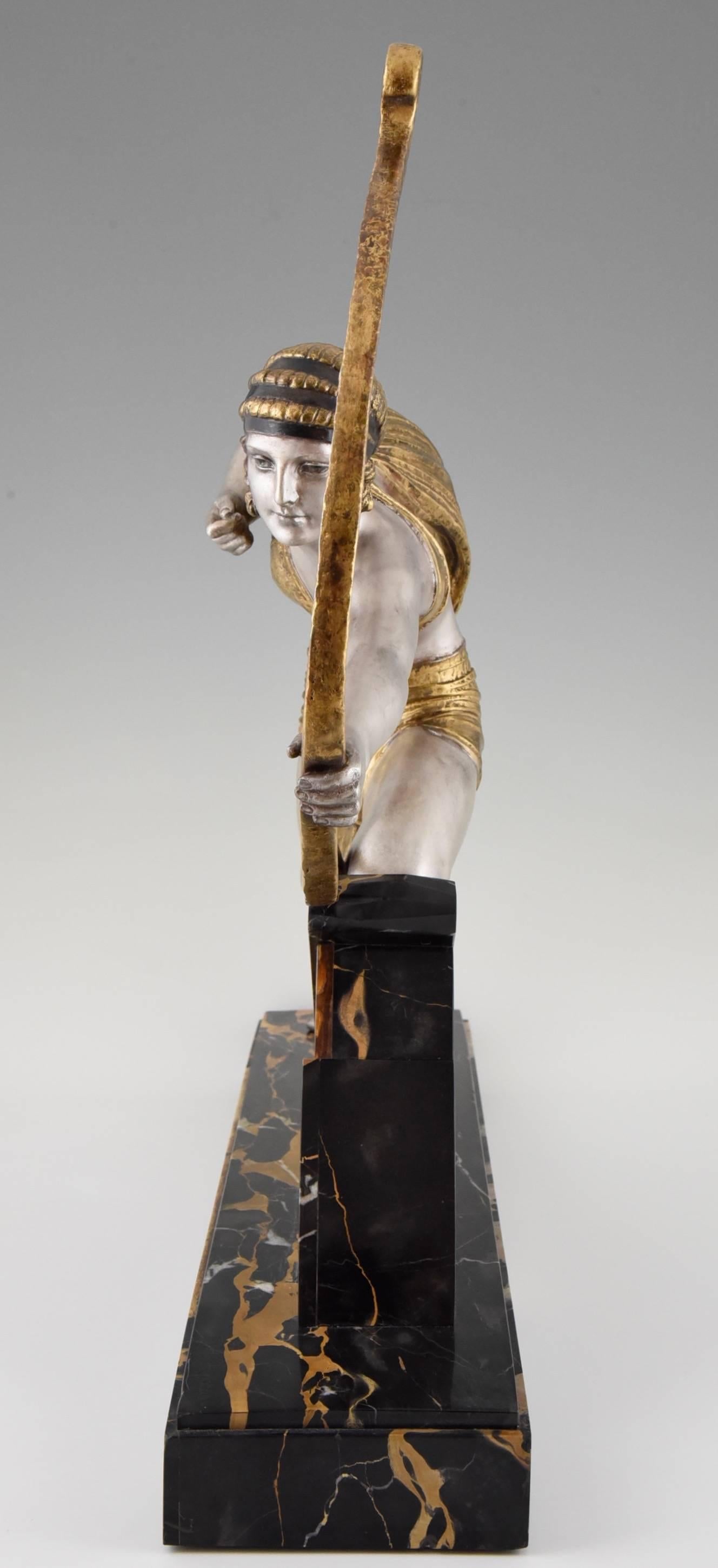 Description:  Diana, Art Deco sculpture on a marble and onyx base.
Artist/ Maker: Demetre H. Chiparus.
Signature/ Marks:  D. H. Chiparus.
Style:  Art Deco.		
Date:  Ca. 1930.
Material: Multi color patina on metal.  Portor and onyx marble base. 