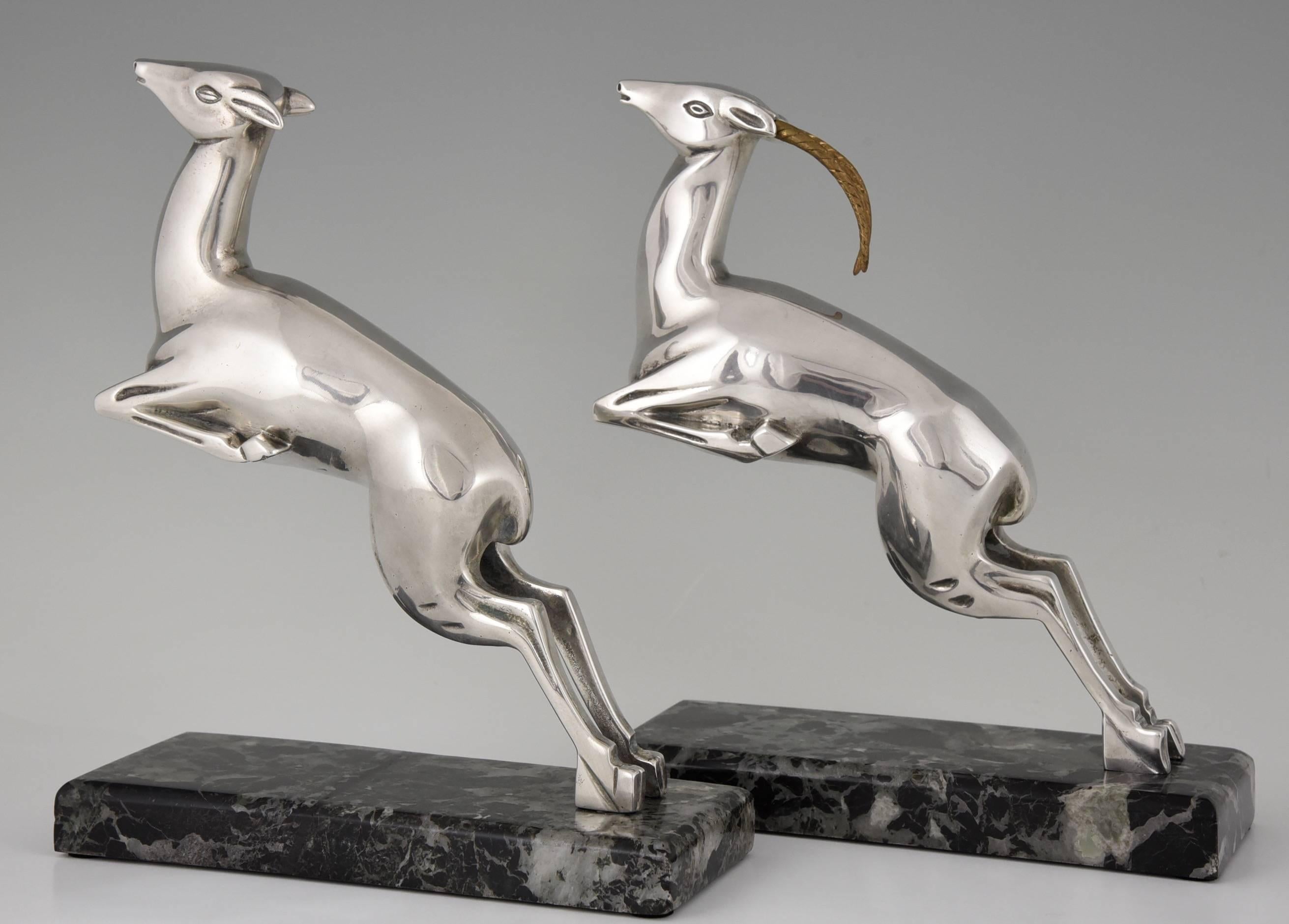 Description:  Art Deco silvered bronze leaping deer bookends.
Artist/ Maker: Marcel André Bouraine,1886-1948. 
Signature/ Marks: Bouraine
Style:  Art Deco. 
Date : circa 1925-1930.
Material: Silvered bronze.  Green marble base. 
Origin: