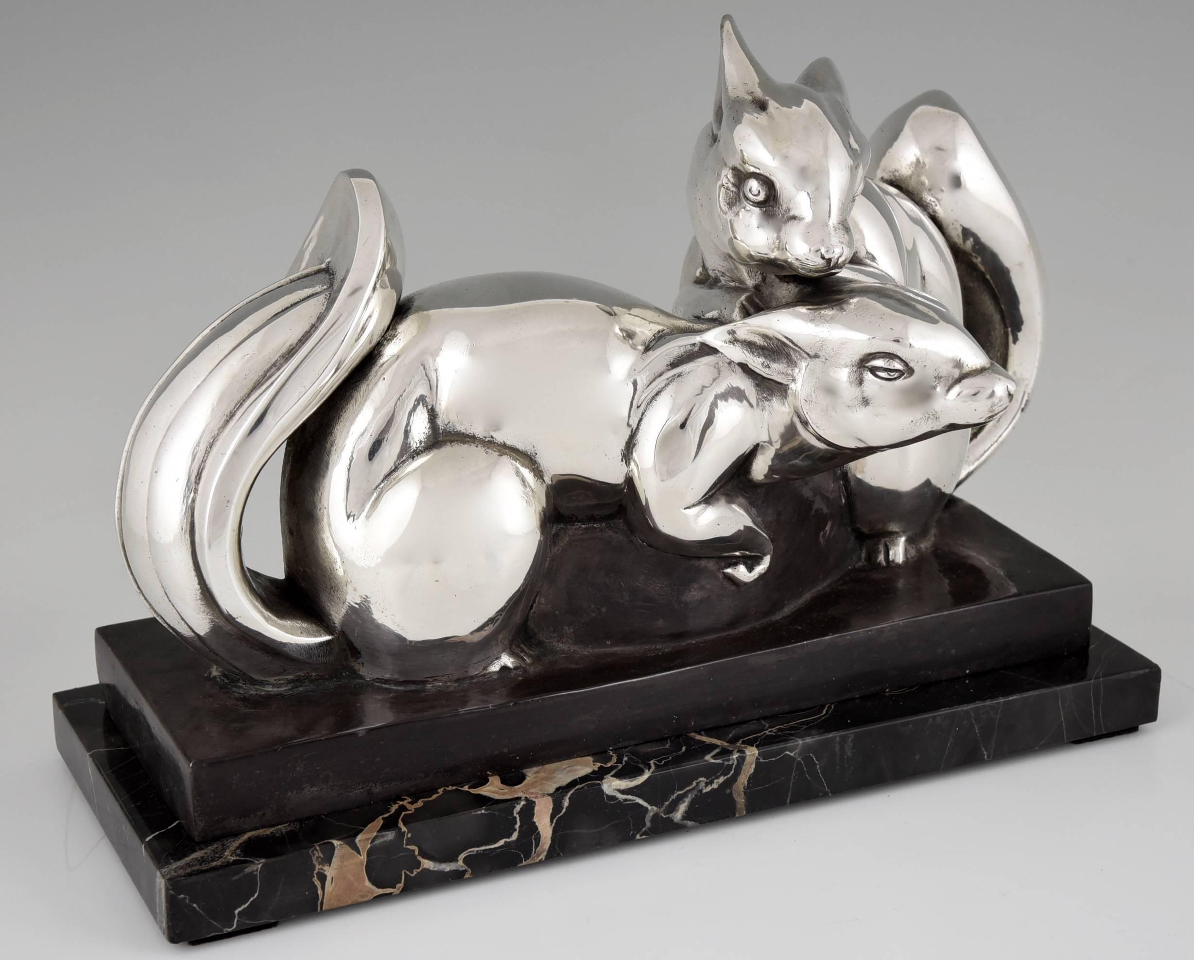 Description:  Art Deco silvered bronze sculpture of two squirrels. 
Artist/ Maker:  Jean de la Fontinelle.
Signature/ Marks:  L. Fontinelle. 
Style:  Art Deco. 
Date:  1930. 
Material:  Silvered bronze.  Portor marble base. 
Origin:  France.
