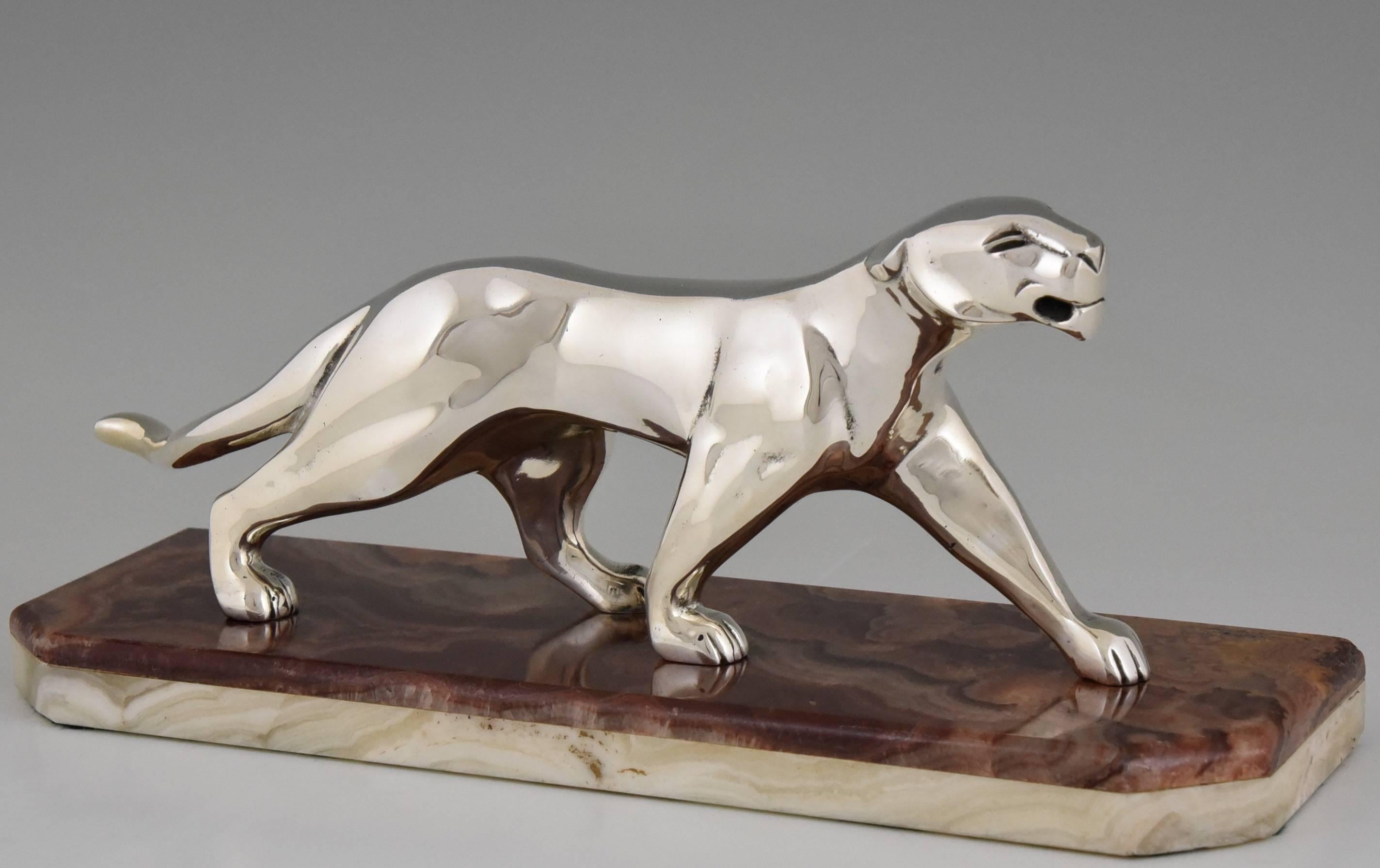 Description:  Art Deco bronze sculpture of a panther.
Artist/ Maker:  Michel Decoux,  France, 1837-1924.
Signature/ Marks:  Coudex. 
Style:  Art Deco. 
Date:  1930. 
Material: Silvered bronze.  Marble base. 
Origin:  France. 
Size: 
L 11.4