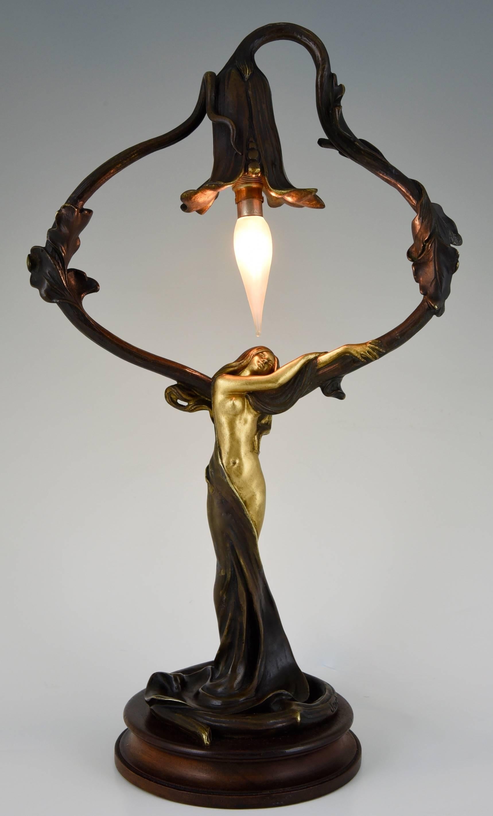 Description: An Art Nouveau gilt an patinated bronze lamp with nude and flower. 
Artist / Maker:  Charles Emile Jonchery. 
Signature / Marks: Jonchery. 
Style:  Art Nouveau. 
Condition: Good original condition. Re-wired for European electricity.