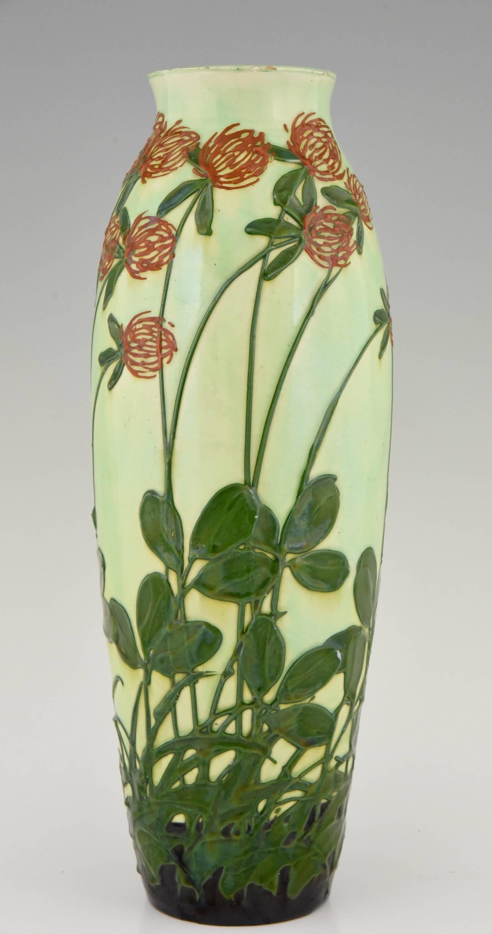 Description: 
 An Art Nouveau ceramic vase decorated with wind blown flowers. 
Maker:
Max Laeuger.
Signature / Marks:  
1. MLK Max Laeuger Kandern stamp.  
2. Nr. 106 V.
3. Muster Gesetzl. Geschützt.  
4. Gesetzl. Geschützt.  
Style: