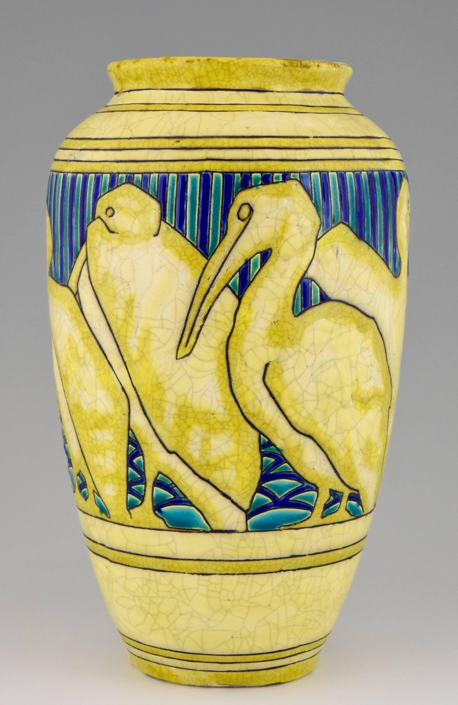 Description: 
Charles Catteau Art Deco vase with pelicans. 

Artist/ Maker:
Charles Catteau,

Signature/ Marks: 
Ch. Catteau.
Stamped:Boch Freres La Louviere fabrication belge.
D 984 ( created in 1924)
Impressed number

Style: 
Art