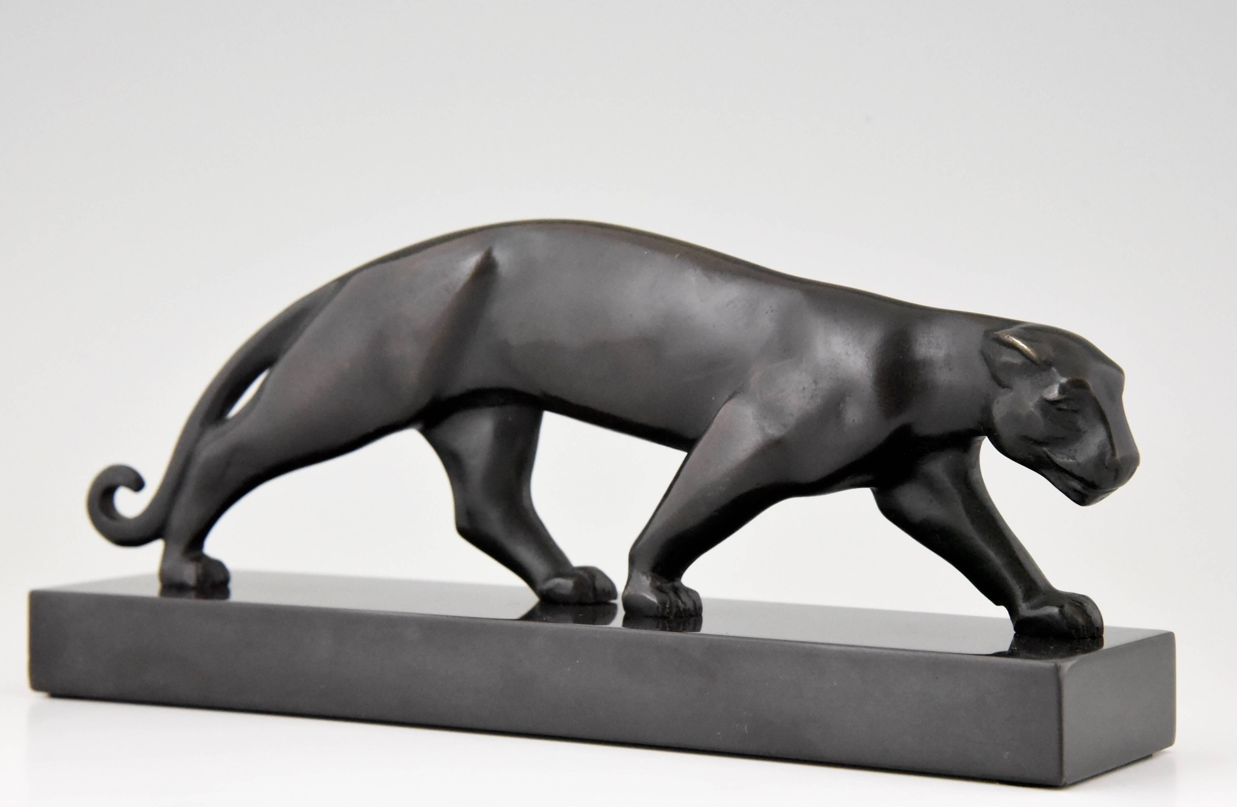 Description:  Art Deco bronze of walking panther. 
Artist/ Maker:  Jean Luc, France.
Signature/ Marks: Luc.  Bronze.
Style:  Art Deco. 
Date:  1930. 
Material:  Bronze, very dark brown almost black patina.  Black marble base. 
Origin:  France.