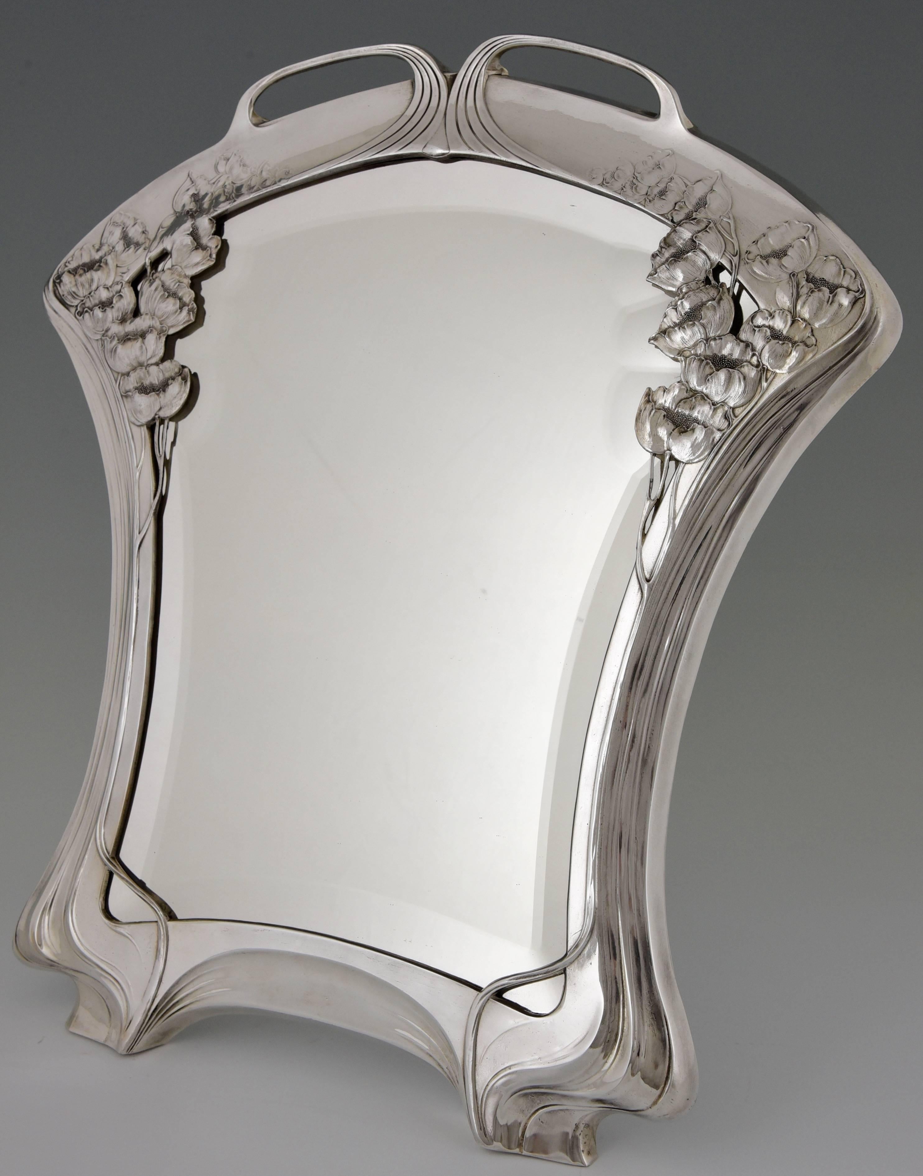 An Art Nouveau mirror with beveled edge “ORIVIT”
Stamped marks: ORIVIT, 2369
Date: 1904

This model is illustrated on page 97 of
Orivit, Zinn des Jugendstils aus Köln.