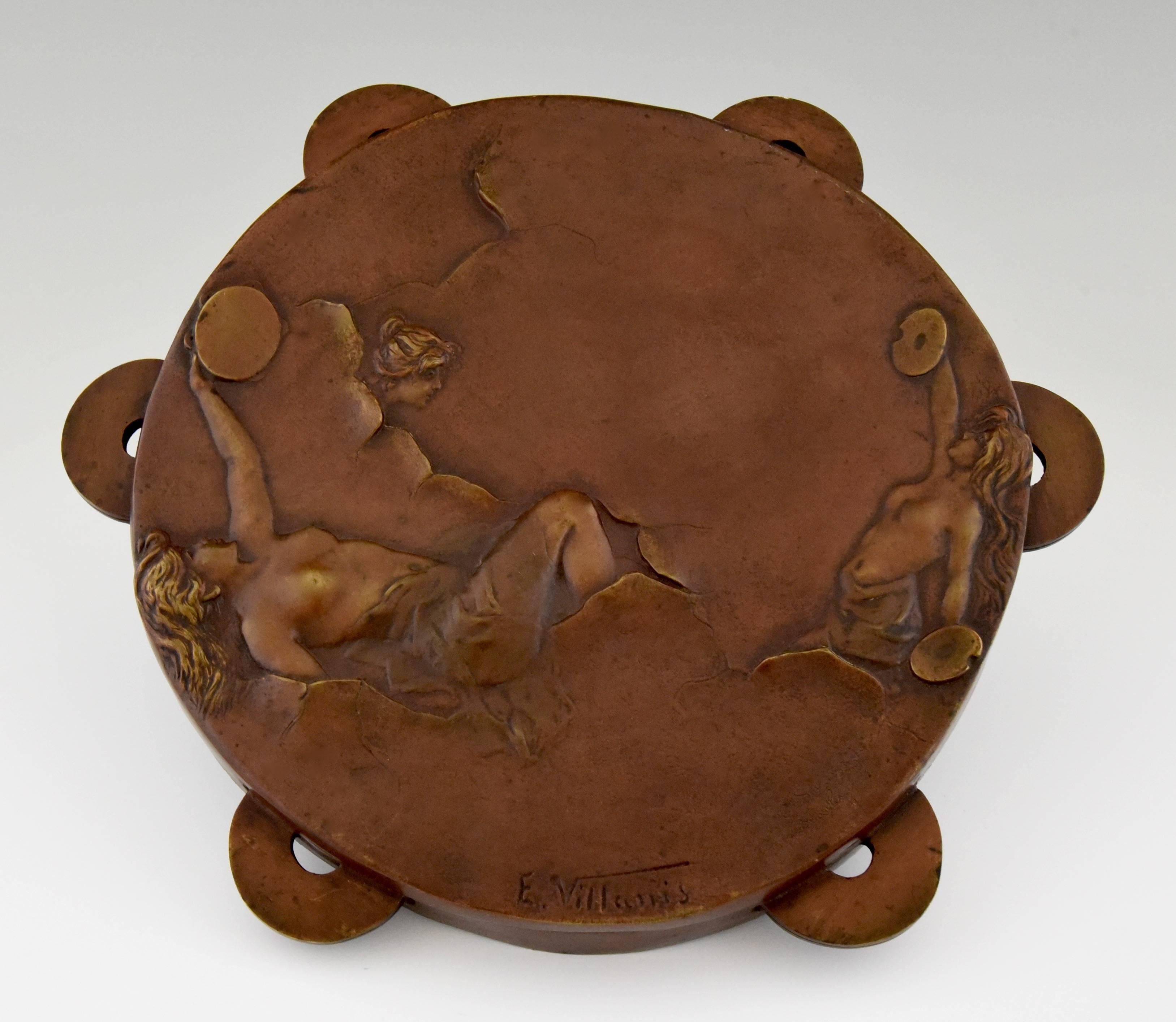 Bronze tambourine decorated with nudes playing cymbals and tambourine. 

Literature:
“Emmanuel Villanis, un sculpteur art nouveau” by Pascal Launay. Thélès. 
Illustration of this model on page 124.