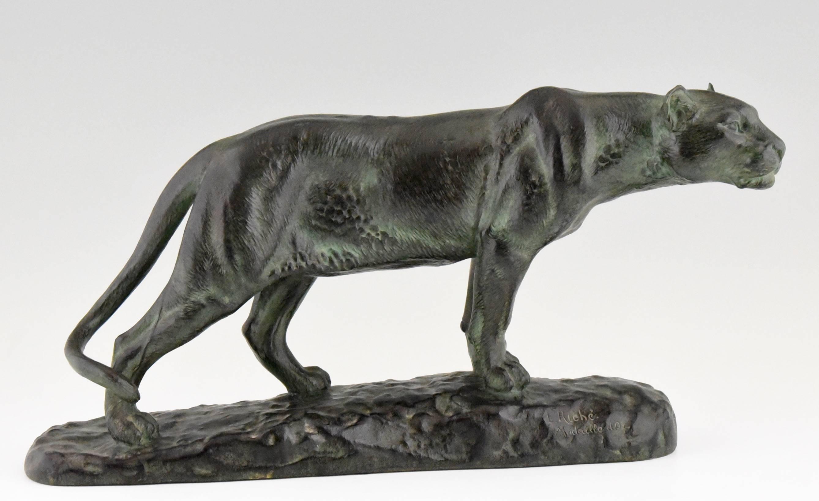 A bronze sculpture of a standing panther by Louis Riché,
Signed: L. Riché, Patrouilleau éditeur, Paris. Medaille d’or. Stamped: Bronze.

Literature:
