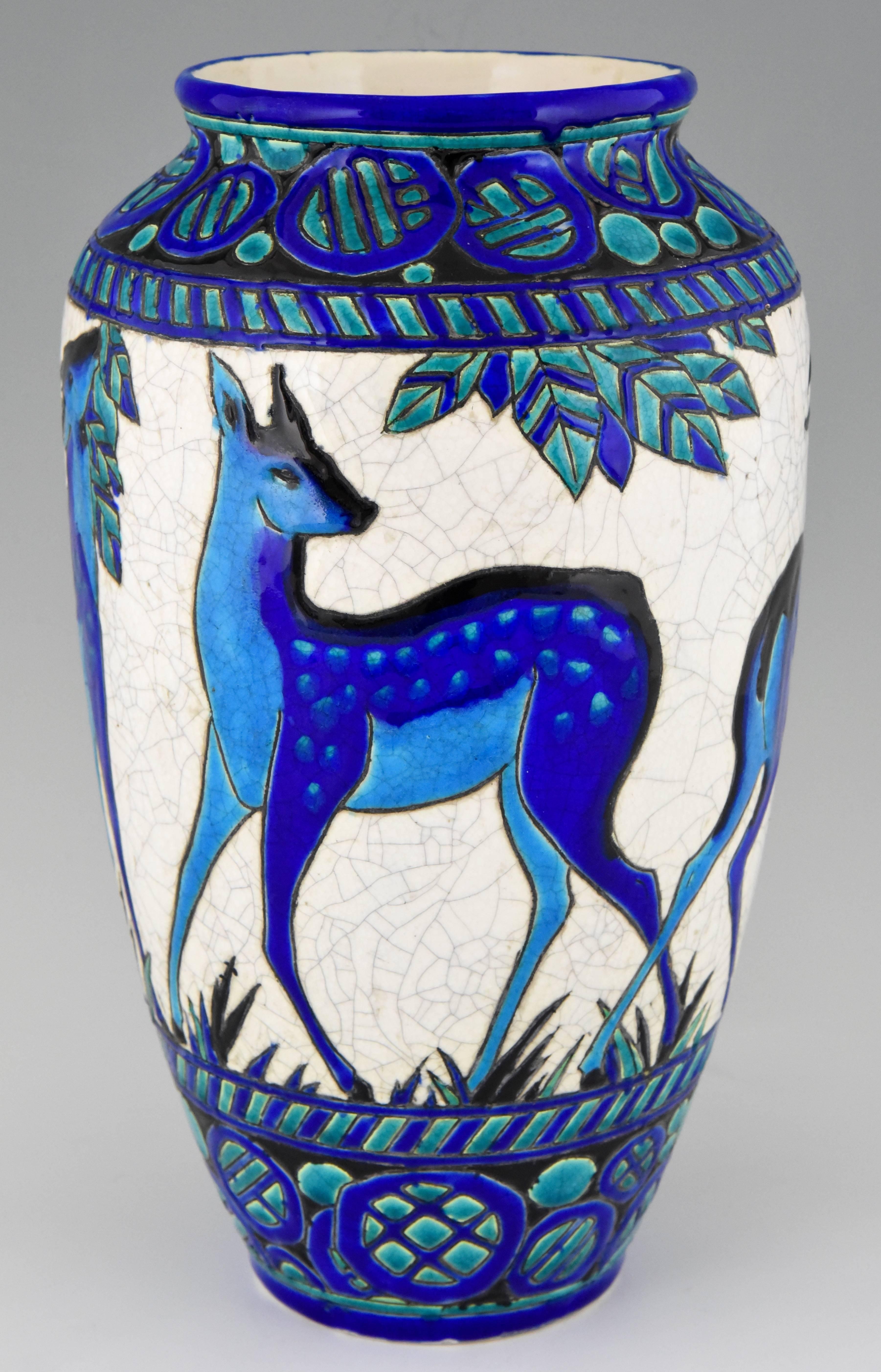 Art Deco ceramic vase with deer designed by Charles Catteau for the line “Biches Bleues” for Boch Freres, La Louviere, Belgium.

Artist/ Maker: Charles Catteau for Boch Freres.
Signature/ Marks: Boch Freres seal. D 943 decor created between