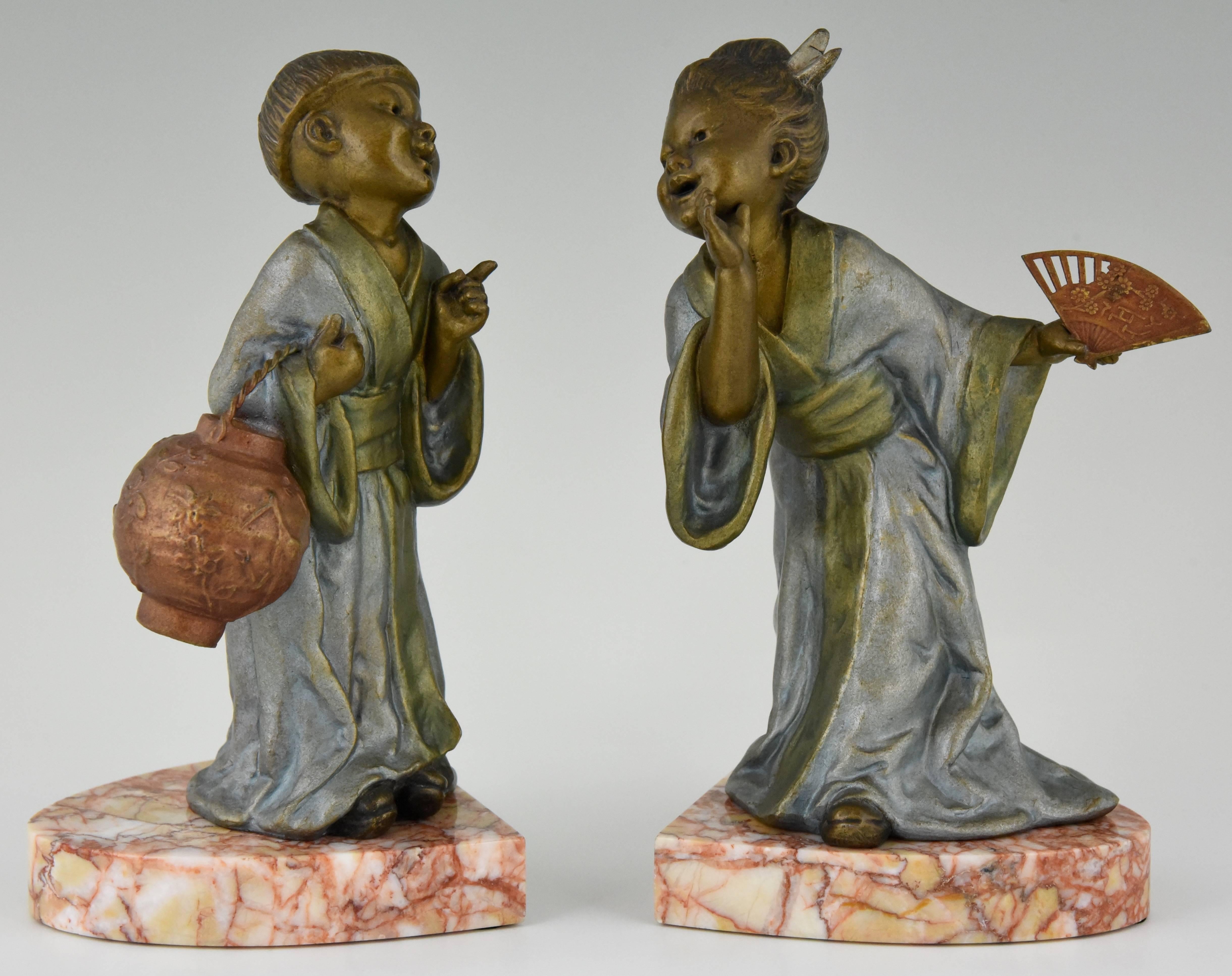 Lovely pair of bookends with a Chinese boy and girl.
Signature/ Marks: Geo Maxim
Style: Art Deco
Date: 1930
Material: Metal with multicolor patina on marble base.
Origin: France
Size: H 20 cm. x L 12 cm. x W 9.5 cm.? 
H 7.9 inch x L 4.7 inch