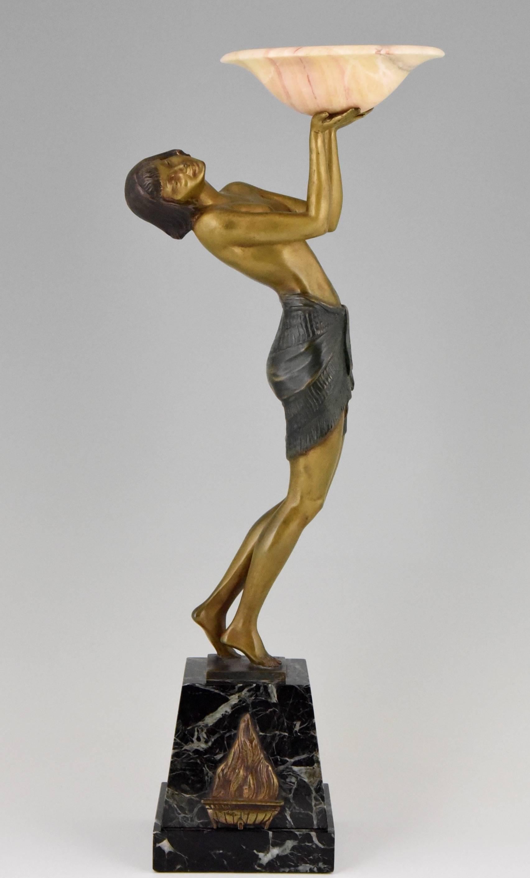 Art Deco bronze of a woman holding a tray.  
The marble base has a bronze decoration. 
Signed by the french artist Pierre Laurel.

Literature: 
“Bronzes, sculptors and founders” by H. Berman, Abage.  
“Art deco sculpture” by Victor Arwas,