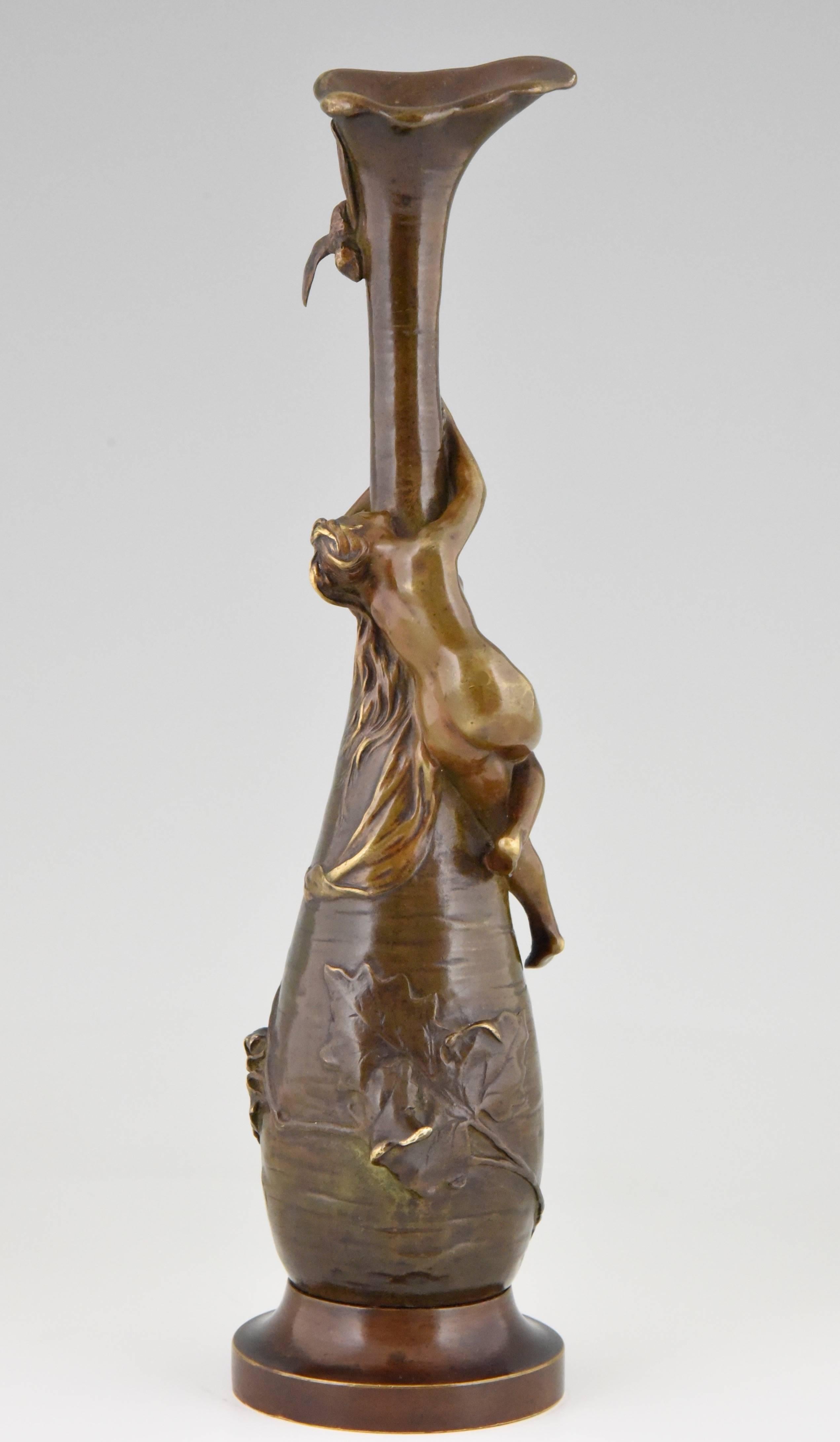 Art Nouveau vase with a nude reaching out for a dragonfly.  The vase is decorated with leaves. 
Artist: Antoine   Bofill (1865-1925)

Literature:
 “Bronzes, sculptors and founders” by H. Berman, Abage. 
 “The dictionary of sculptors in bronze”